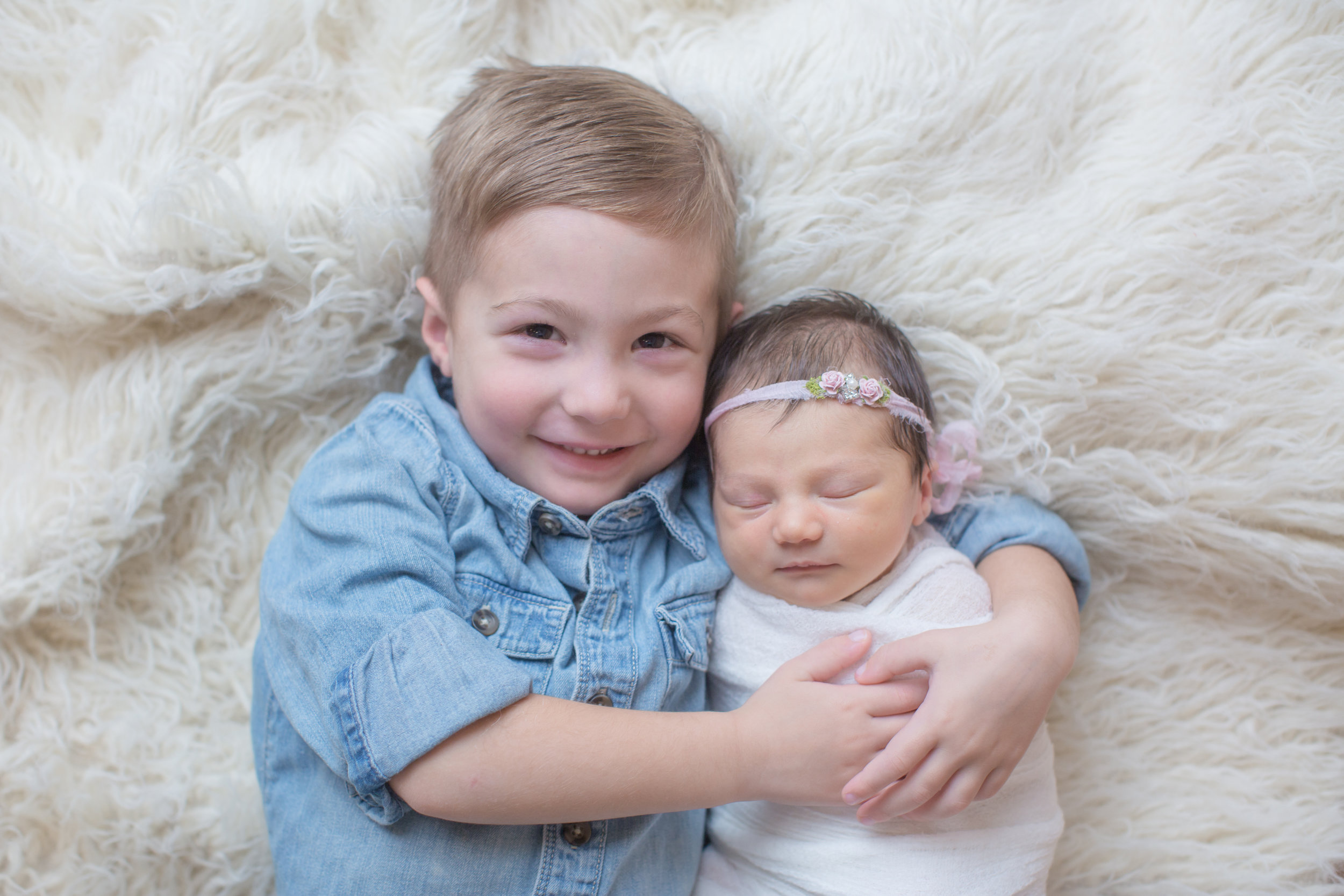  newborn sibling photo with big brother in davison michigan 