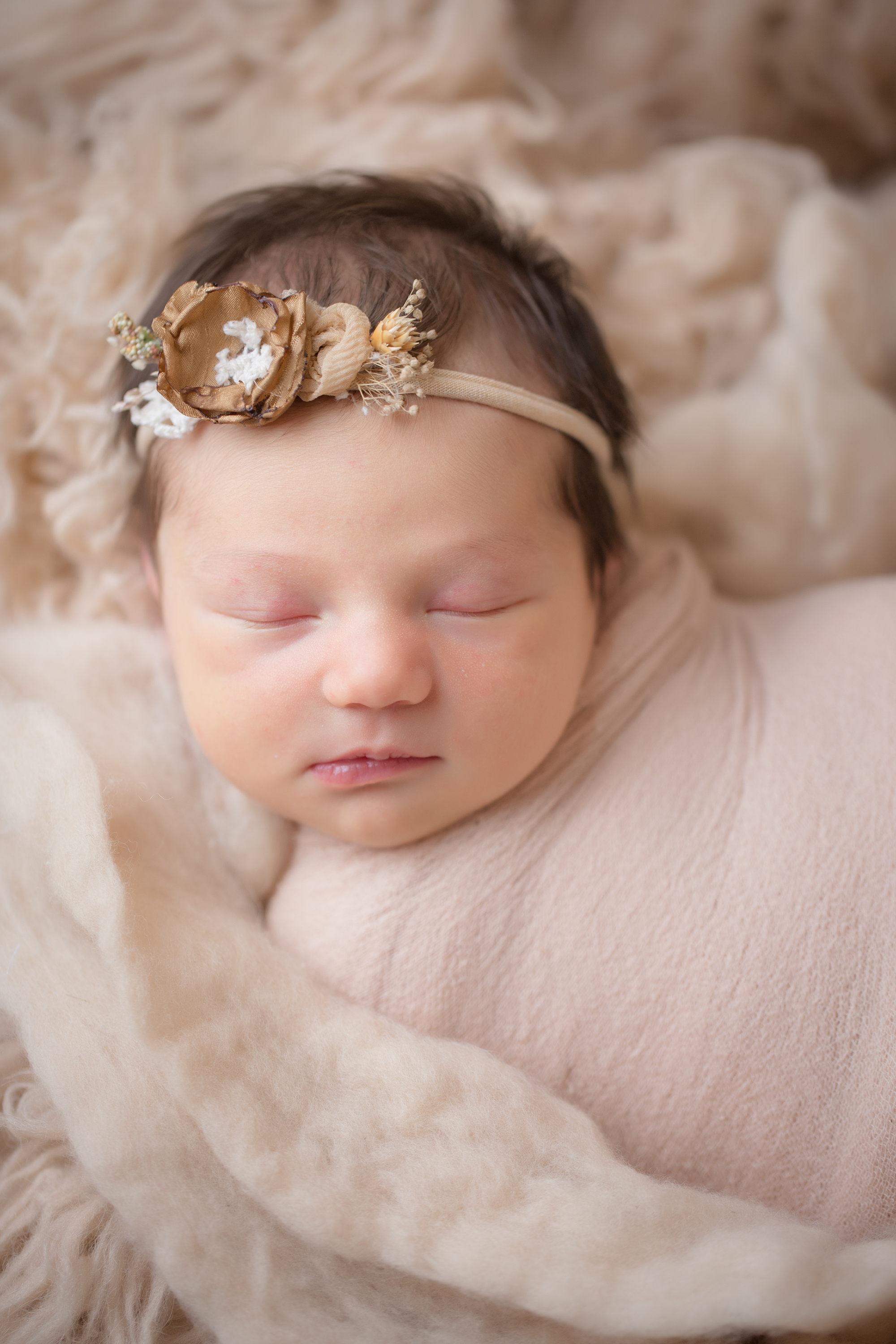  newborn close up of gorgeous headband at newborn studio session inside davison, michigan 