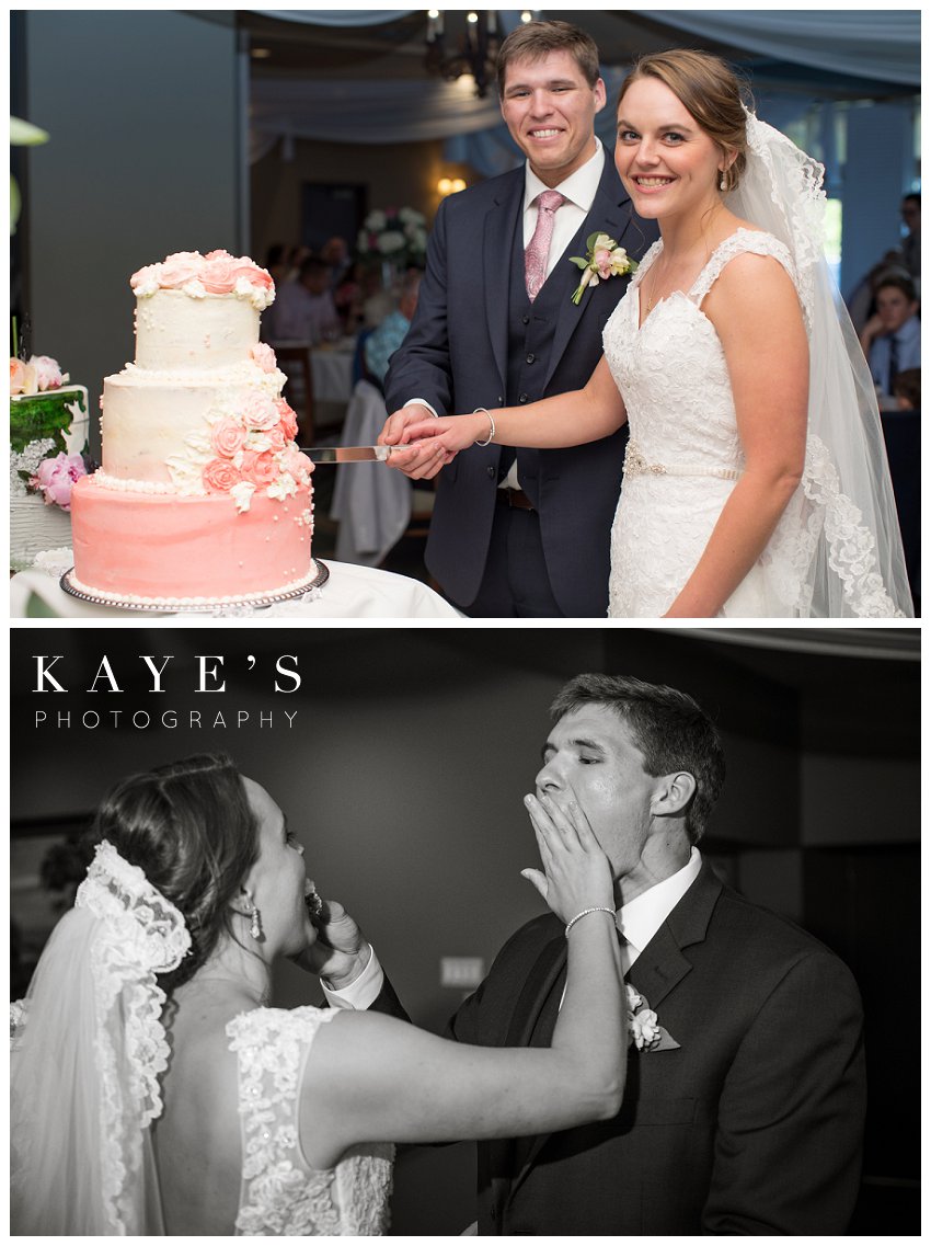 bride and groom cutting their wedding cake and eating it during reception in Flint Michigan