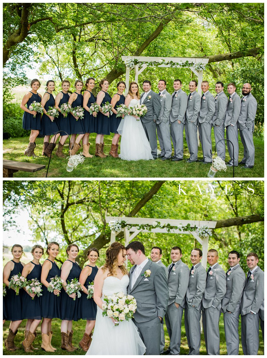 bridal party in navy dresses and grey tuxes at misty farms in ann arbor michigan