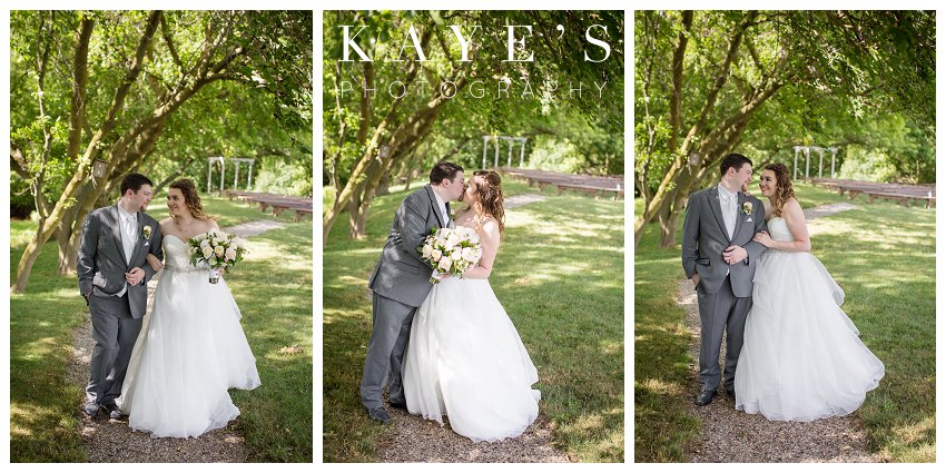 bride and groom posing for wedding portraits at misty farms in ann arbor michigan