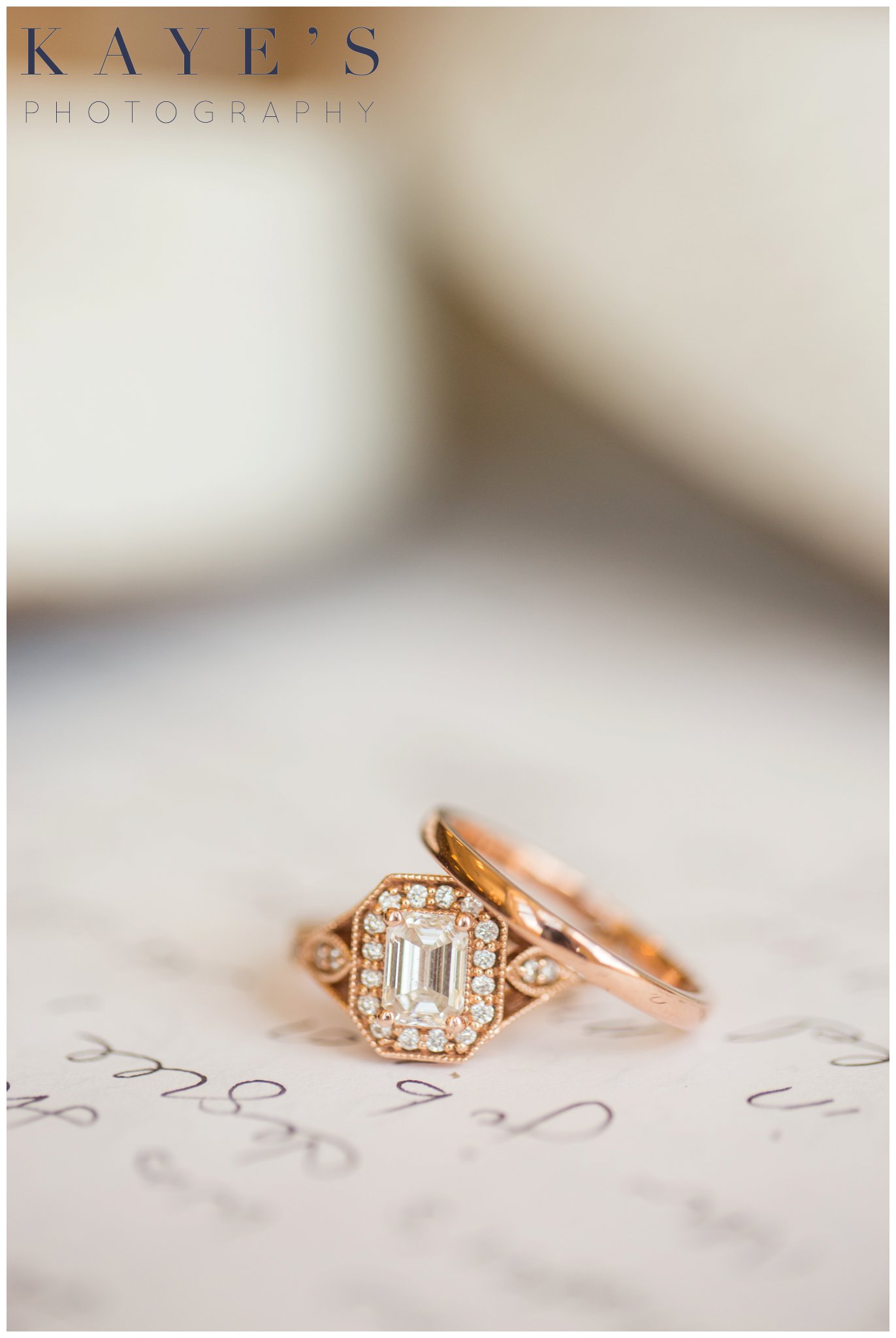 wedding rings on top of written vows