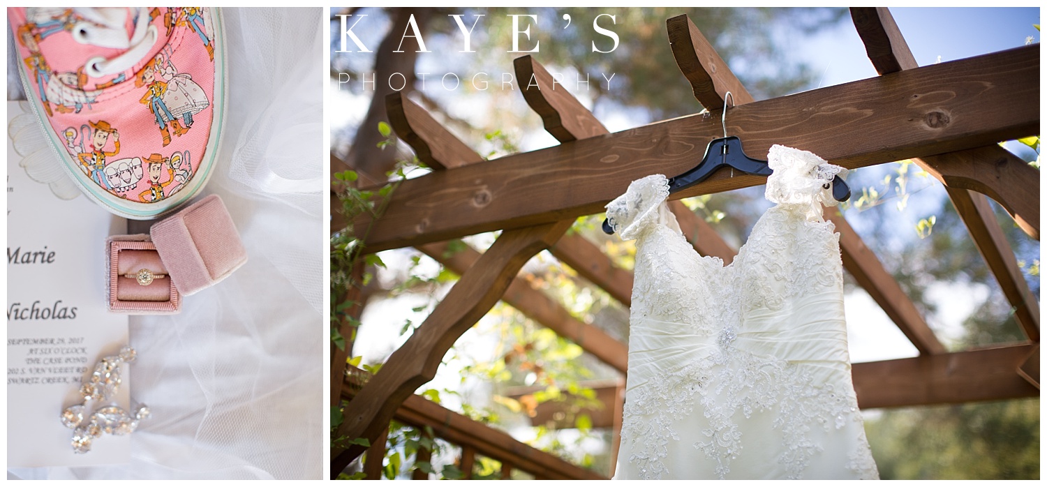 wedding dress hanging with ring in velvet ring box and disney shoes by kayes photography