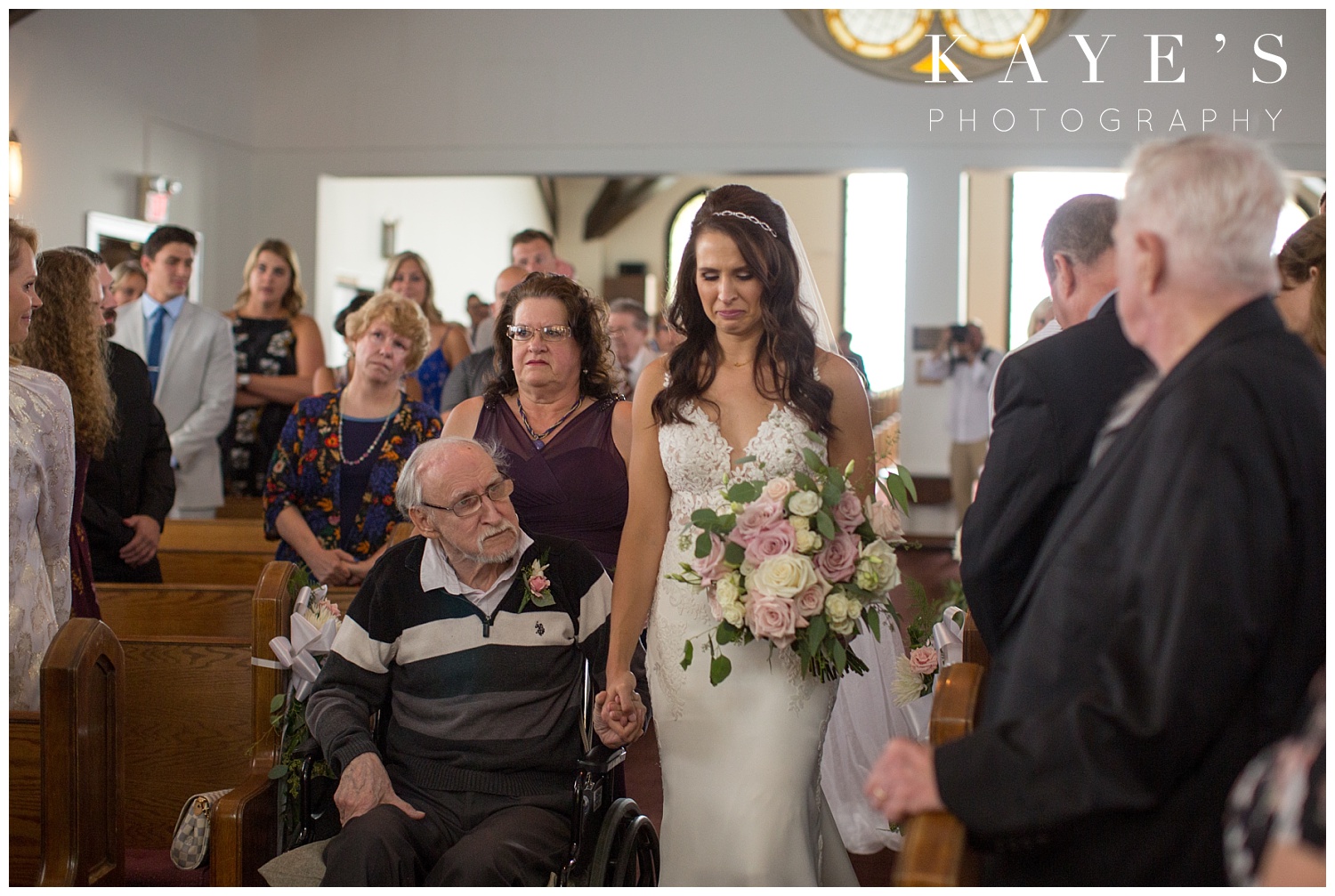 bride coming down the aisle with father in wheelchair in farmington michigan