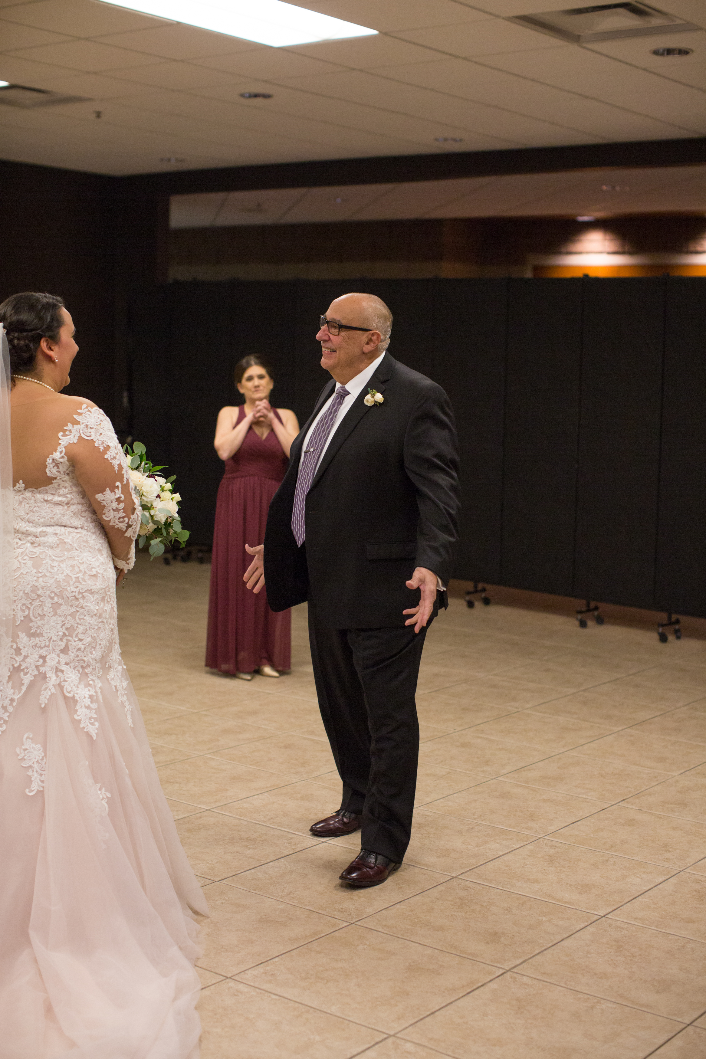 first look with father of the bride during a winter wedding in Sterling Heights