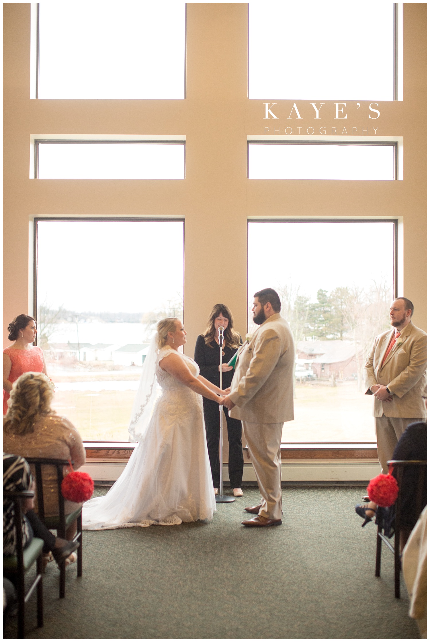 bride and groom at indoor ceremony location at lapeer country club