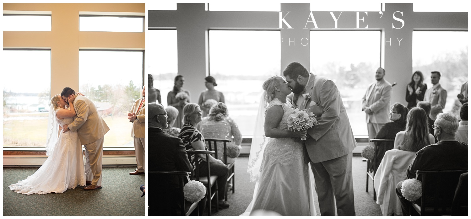 first kiss at indoor ceremony at lapeer country club by kayes photography