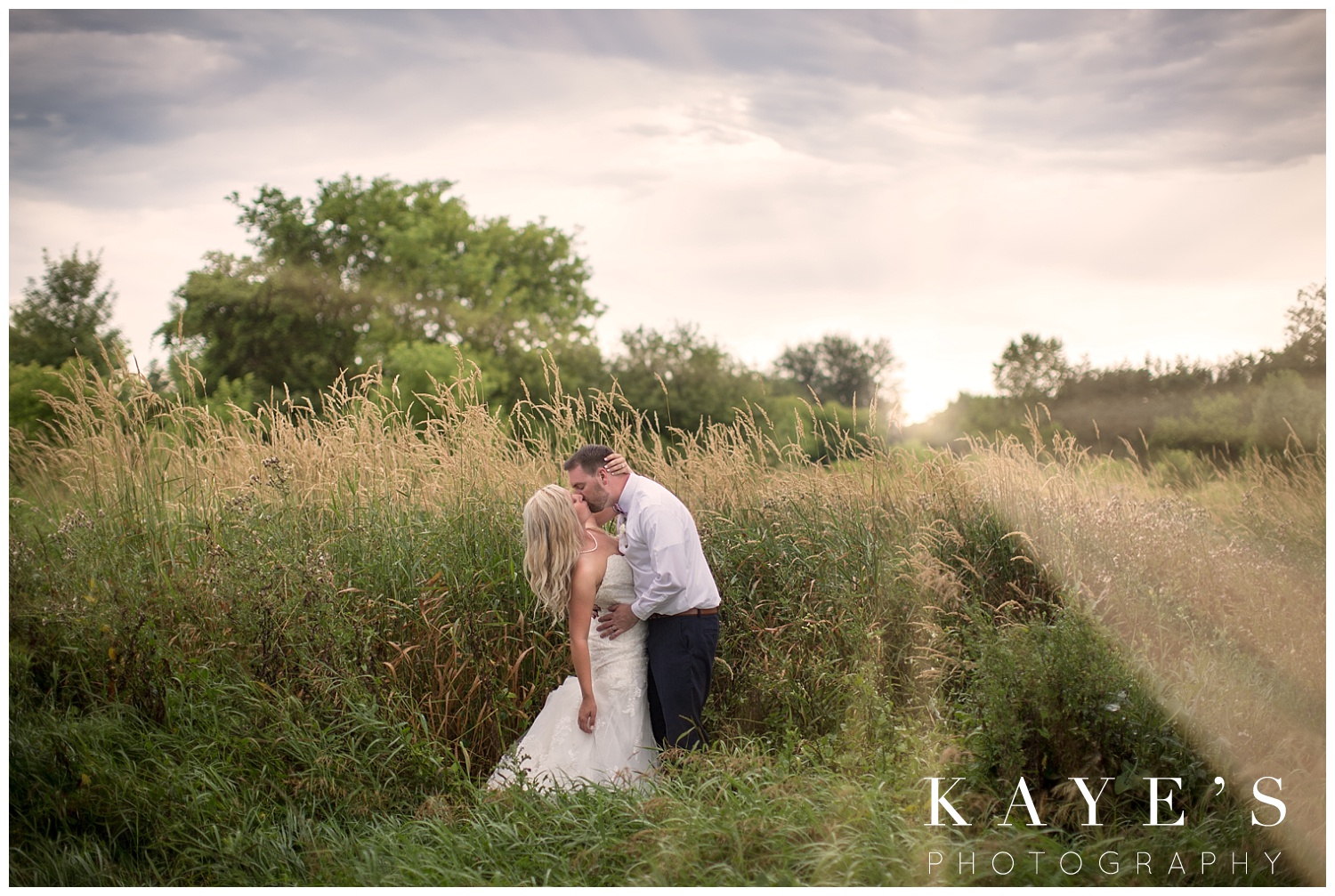 wedding photo at sunset in a field during backyard wedding in grand blanc michigan