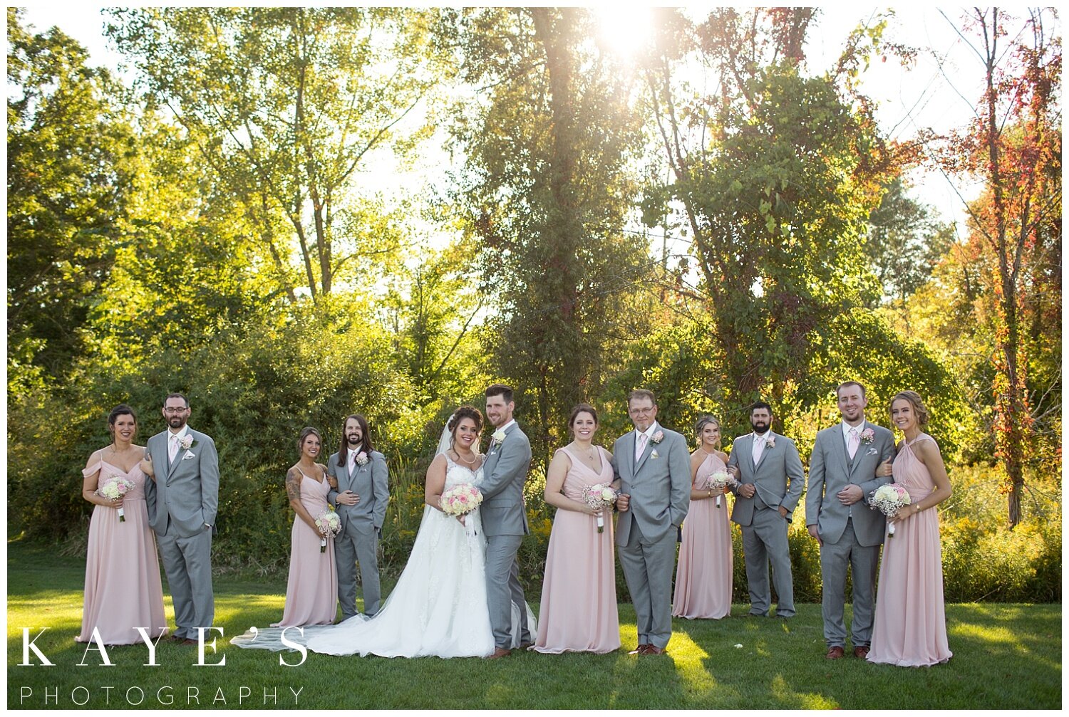 bridal party with bride and groom in grand blanc, michigan at captain's club 