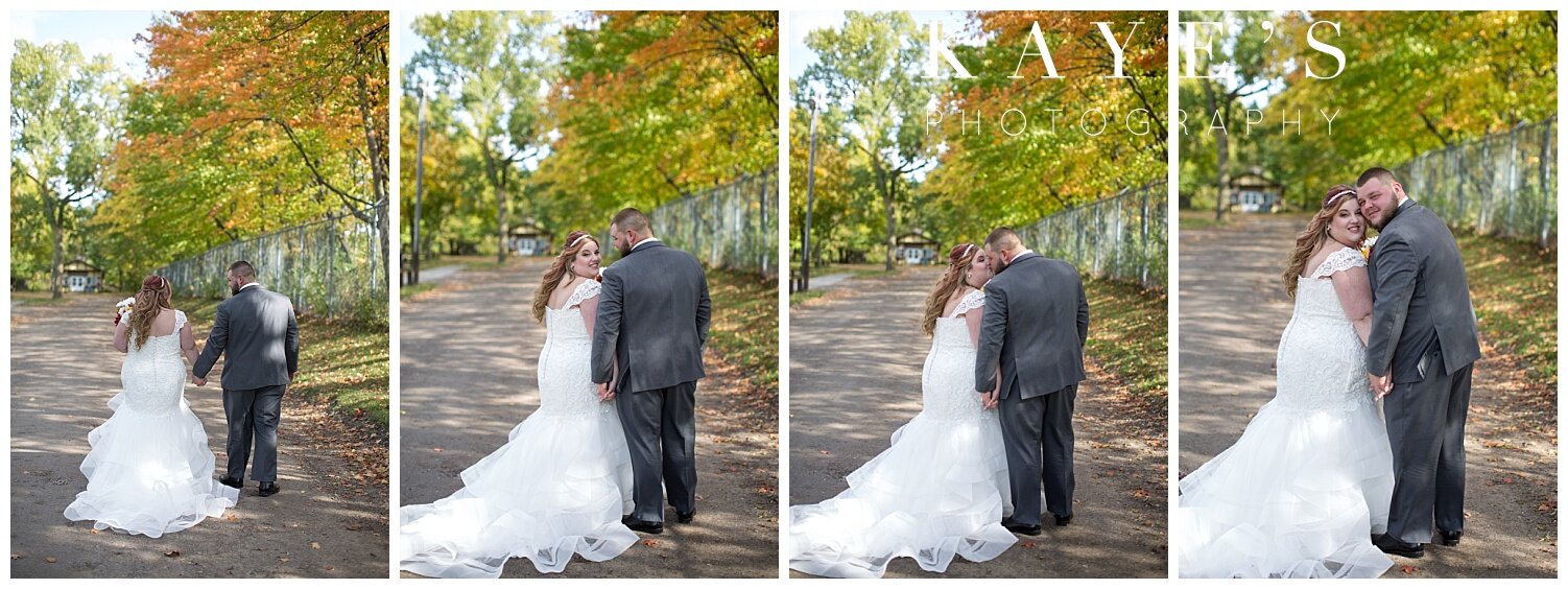 bride and groom wedding portraits during the fall wedding in clio michigan