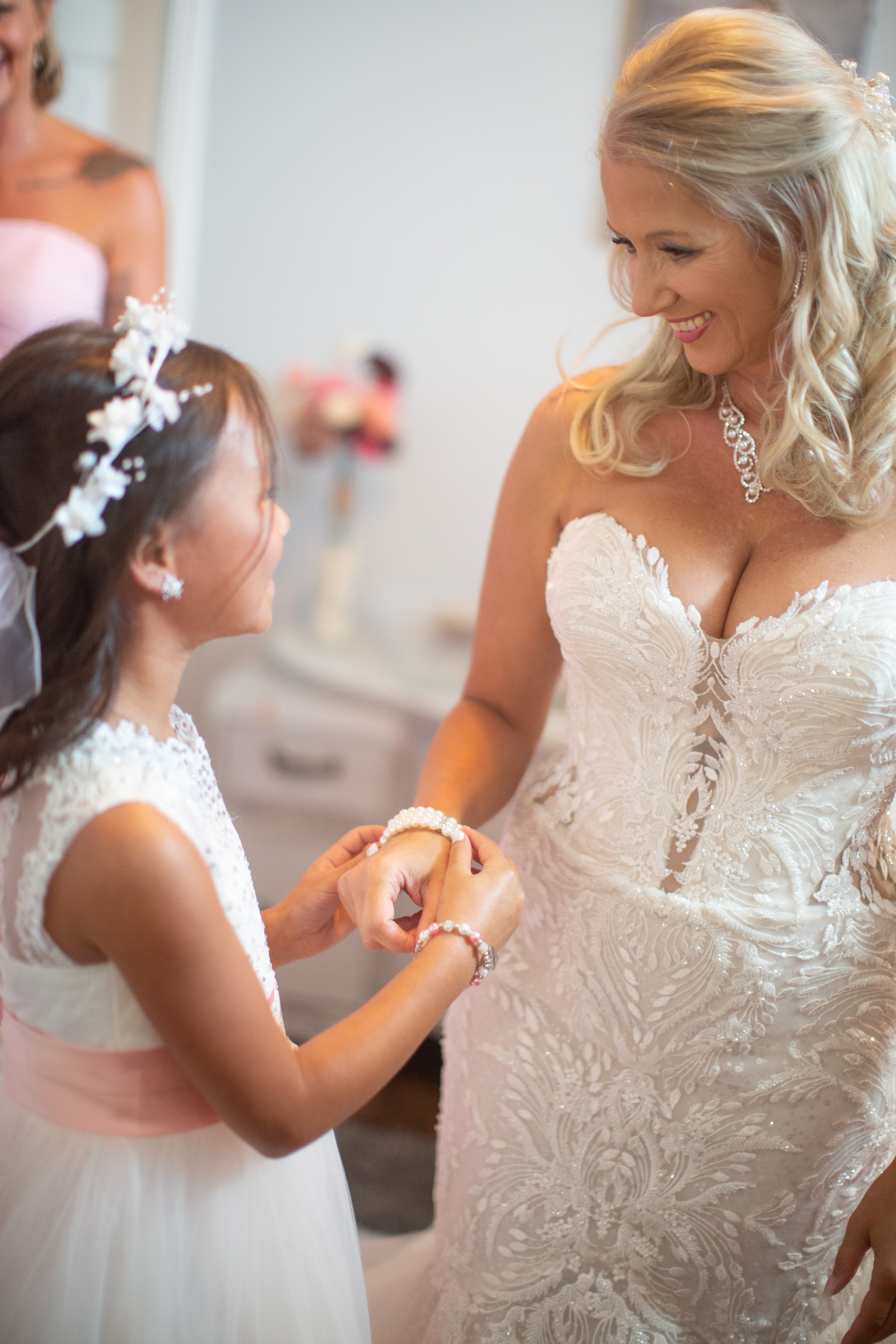 bride and daughter getting ready together by kaye's photography