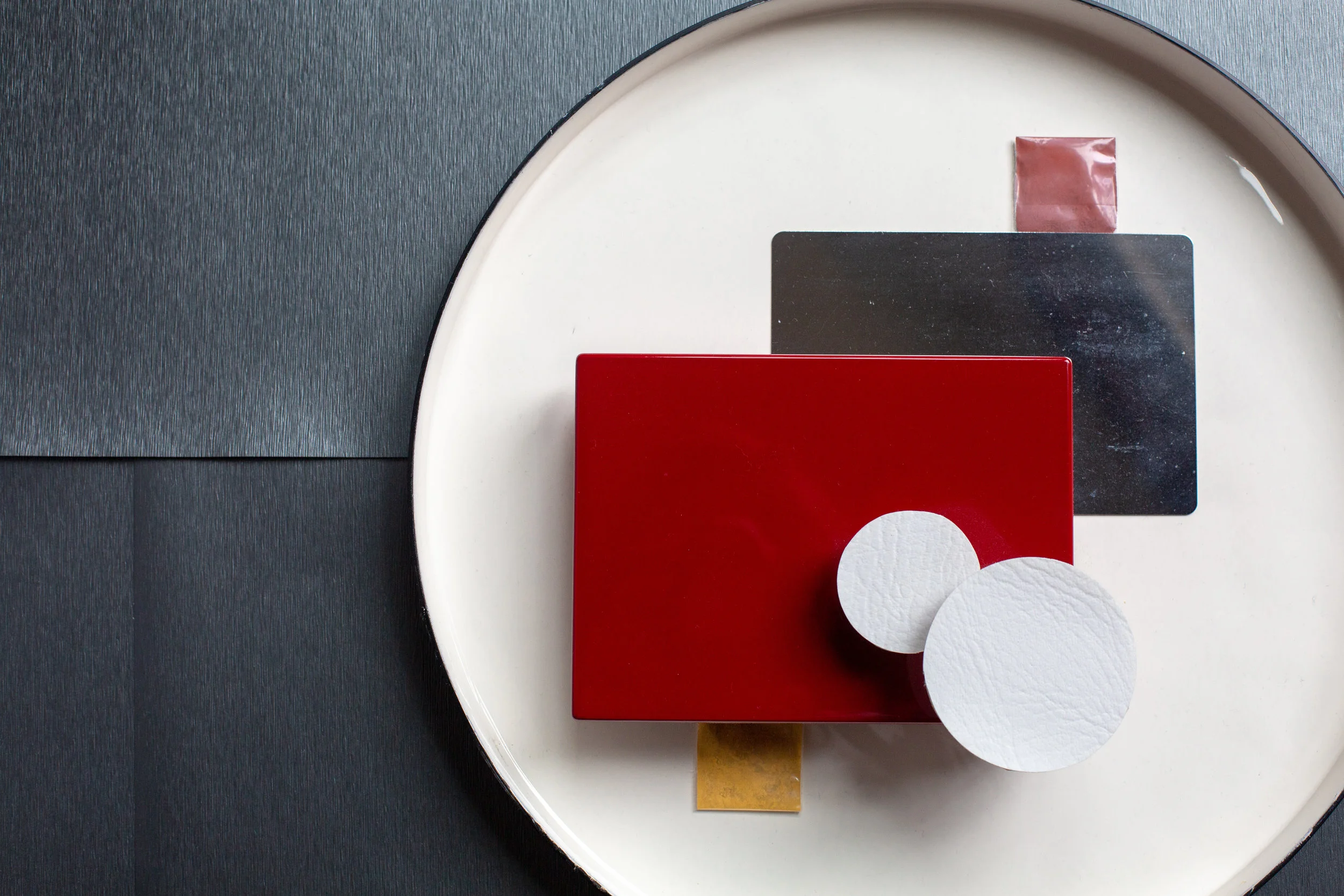 Red Lacquer, chrome, white vegan leather.