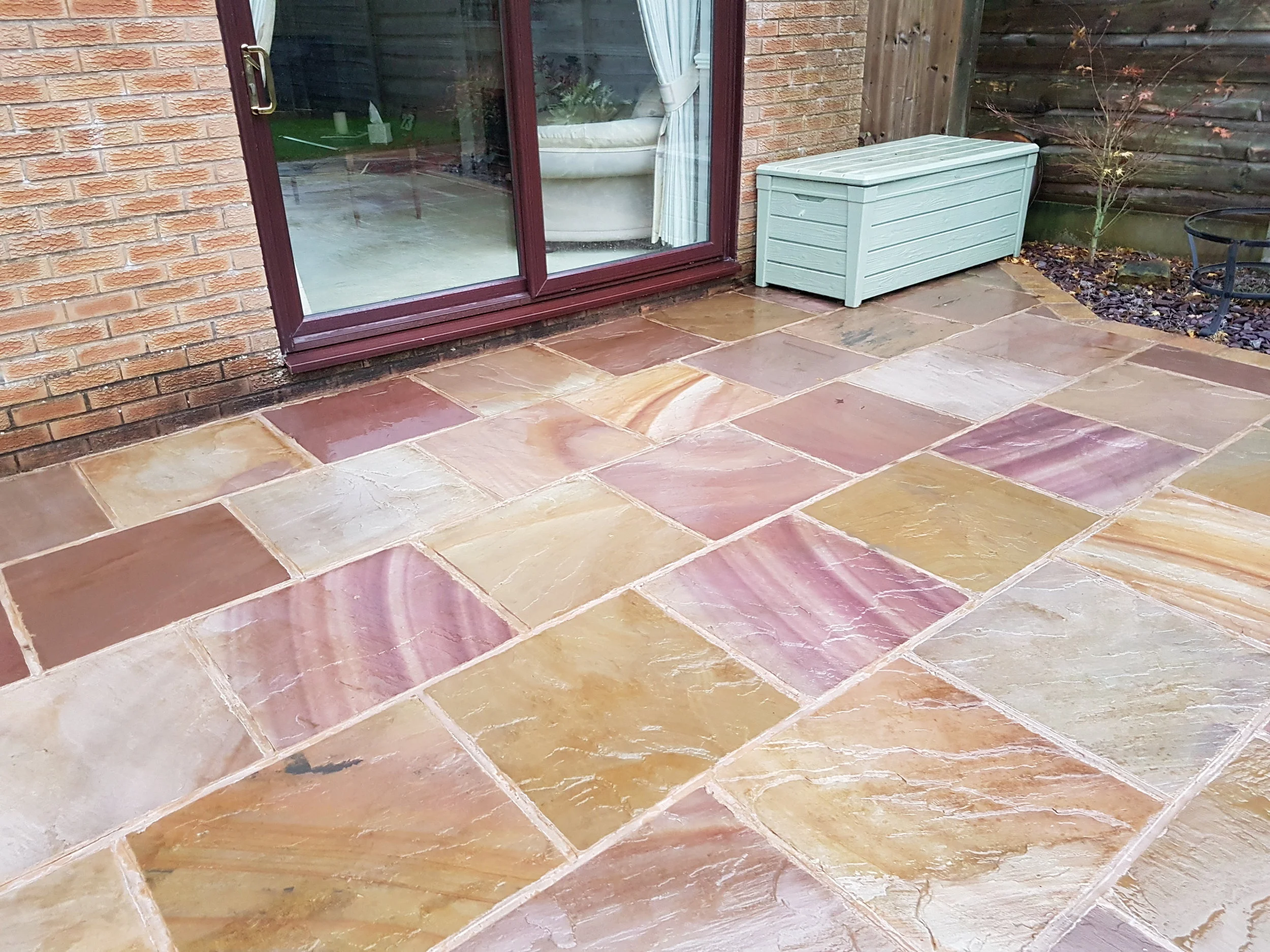 Softwash treatment on Indian stone patio in Rawtenstall.