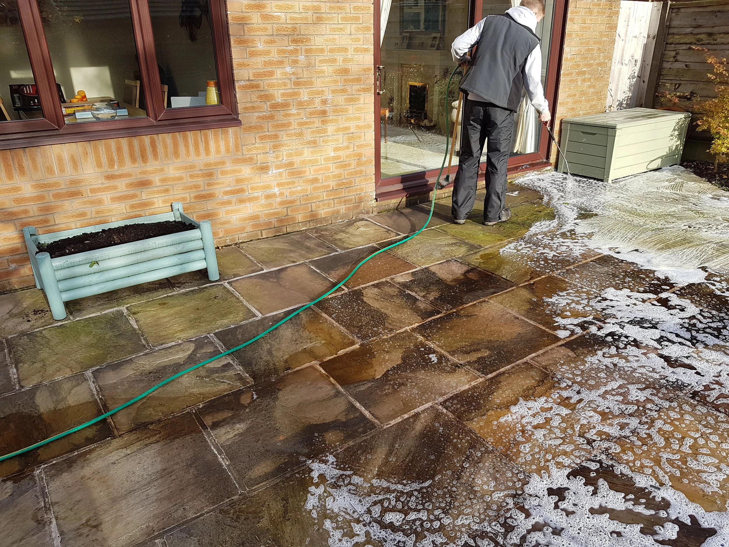 Softwash treatment on Indian stone patio in Rawtenstall.