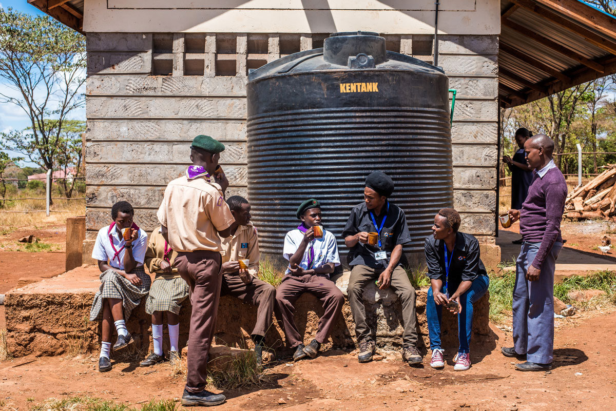 impact-water-kenya-students-outside-drinking.jpg