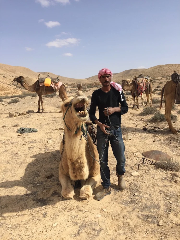 Saeed, with a camel Photo by Andy Teirstein 