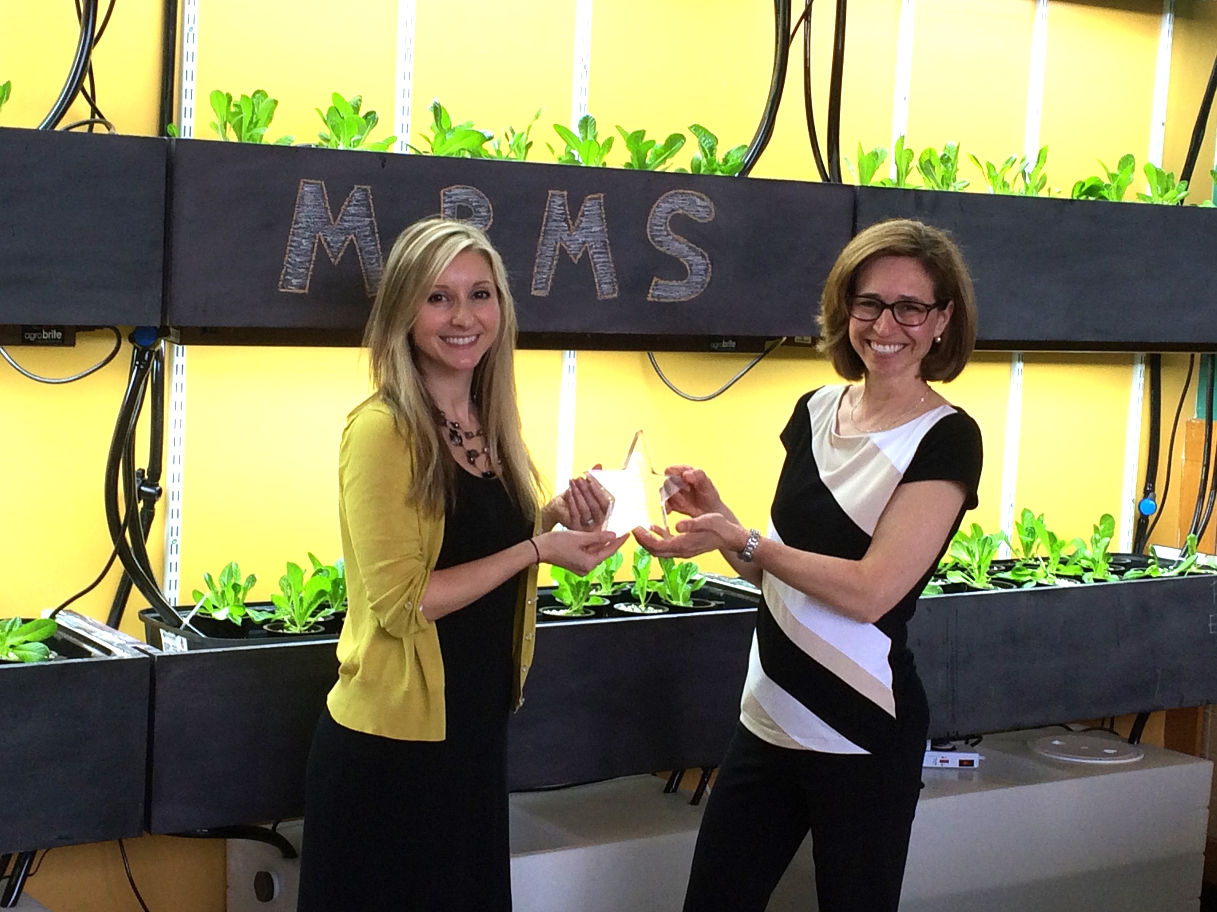 Danielle Petrucci (left) presented with the Over And Above award from Grants Chairperson, Dana Allara.