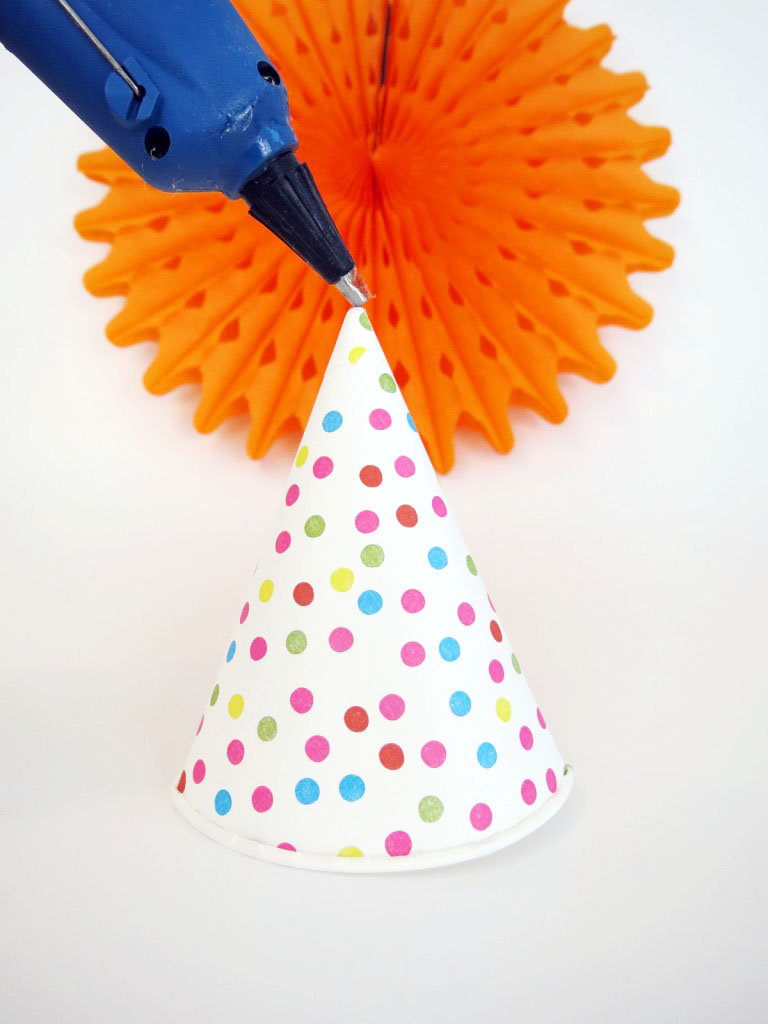 This isn't a regular hat- it's a cool hat! They're cheap and easy to make, and make really cute festive accessories. Click to check out the easy how-to!