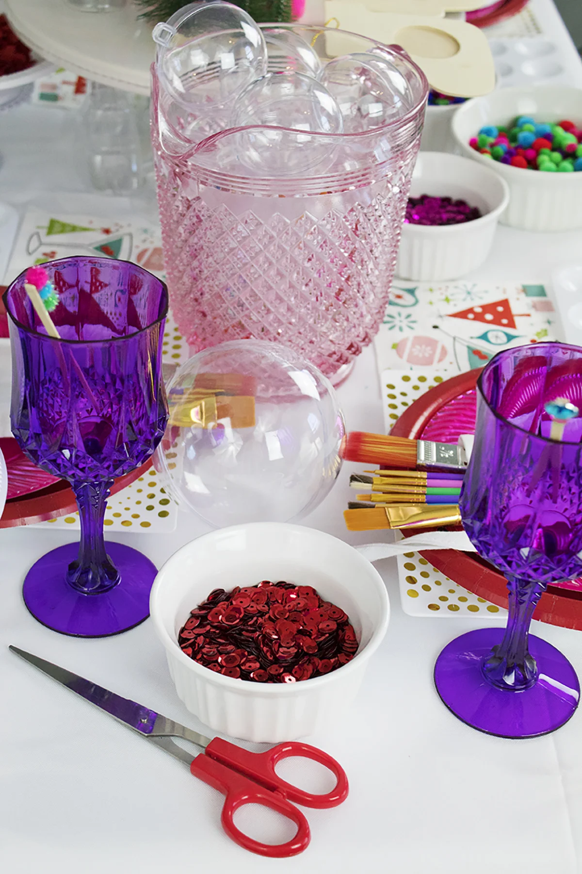 I wanted to whip up a simple party that brings my friends together to do something I personally LOVE- making ornaments! While everyone else is baking cookies, you can find us creating one-of-a-kind baubles for our tree that we can use year after year. Click to see the full party! #christmaspartyideas #christmascrafts #diychristmasornaments #cookieexchangeparty
