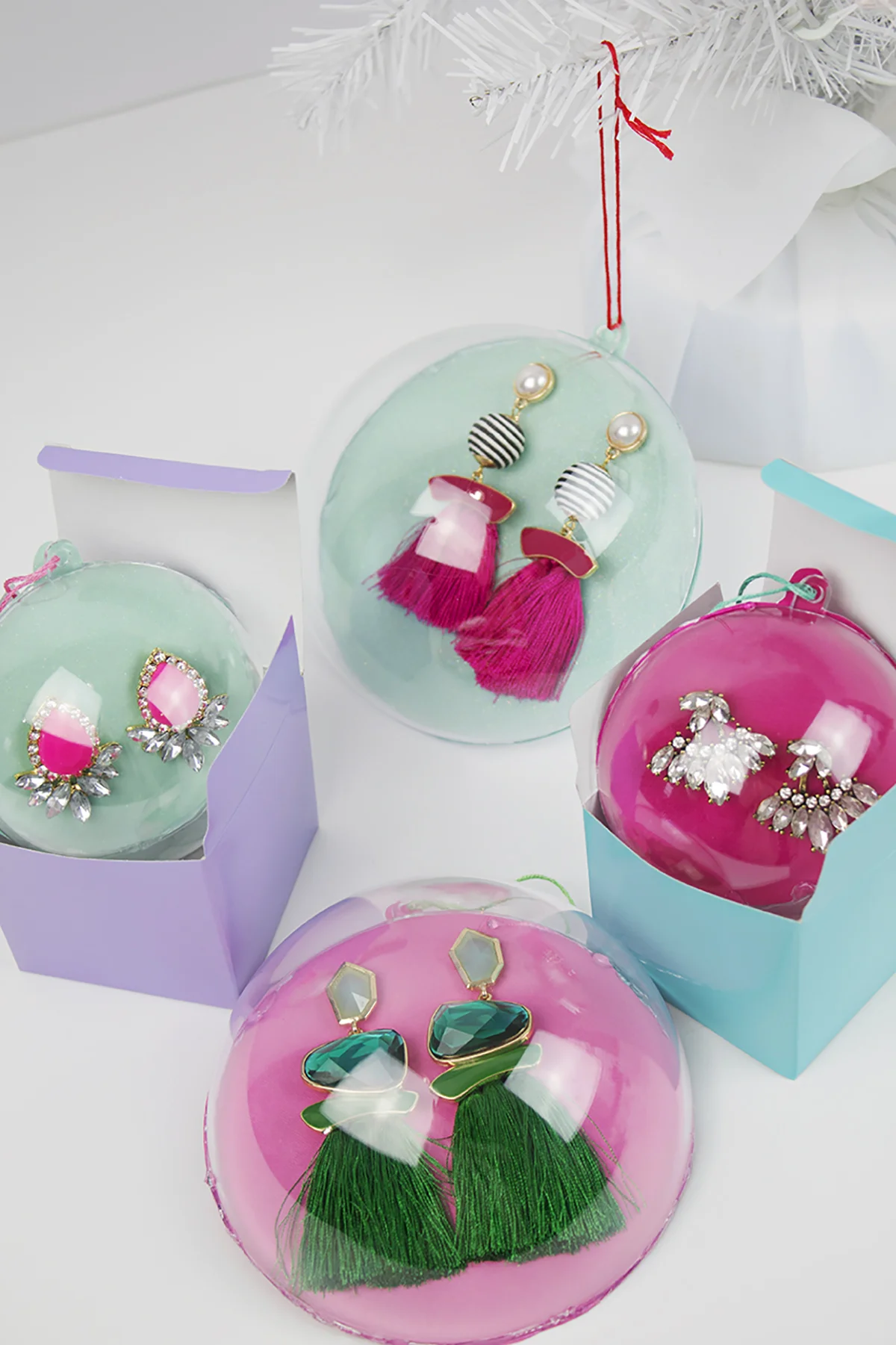 Looking for a great stocking stuffer or Secret Santa gift? These earring ornaments are way more fun than regular ho-hum packaging, and they’re super easy and affordable to do! Click to find the full DIY and check one more thing off your to do list. #diyornaments #stockingstuffer #secretsantagift