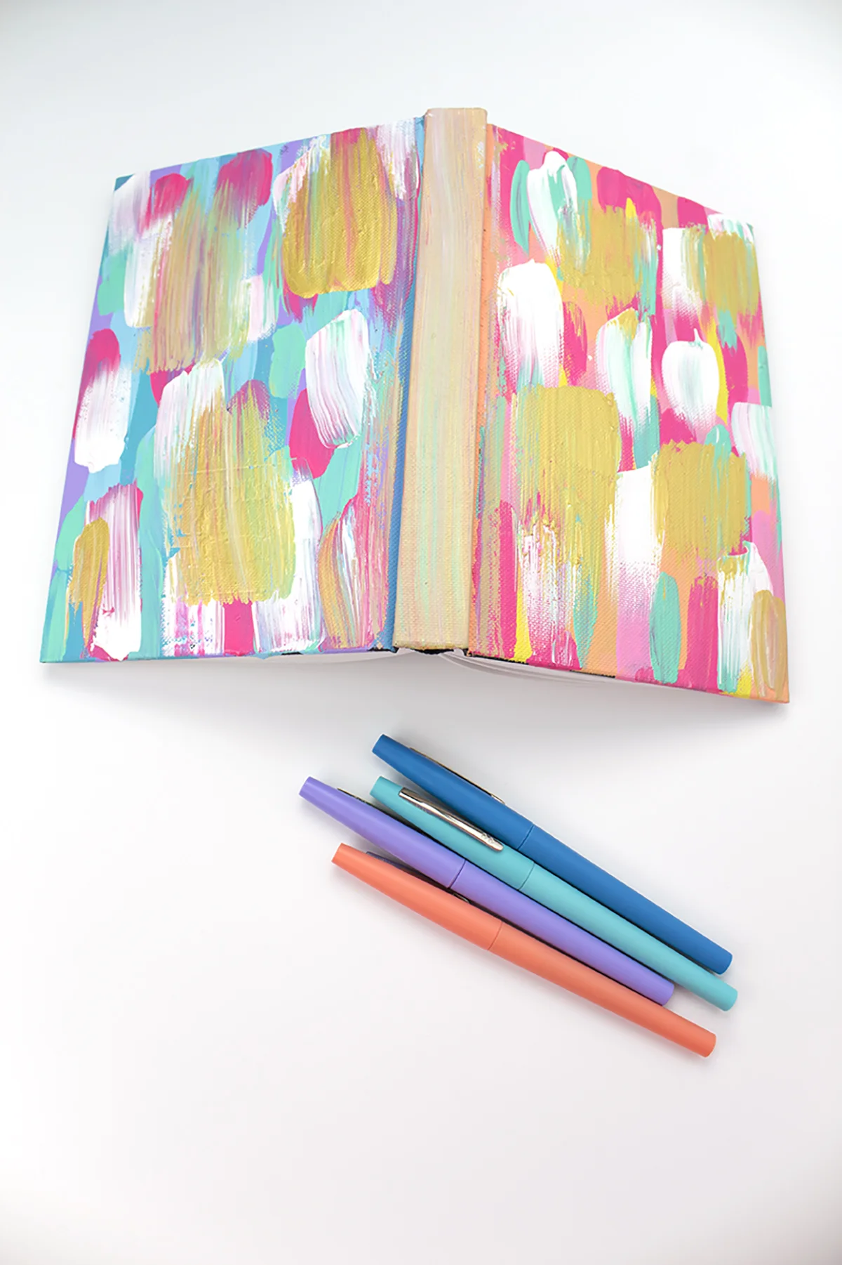 Give your ho-hum notebook a new look with just a coat of paint! Add a metallic accent and you're golden! Click for the DIY.