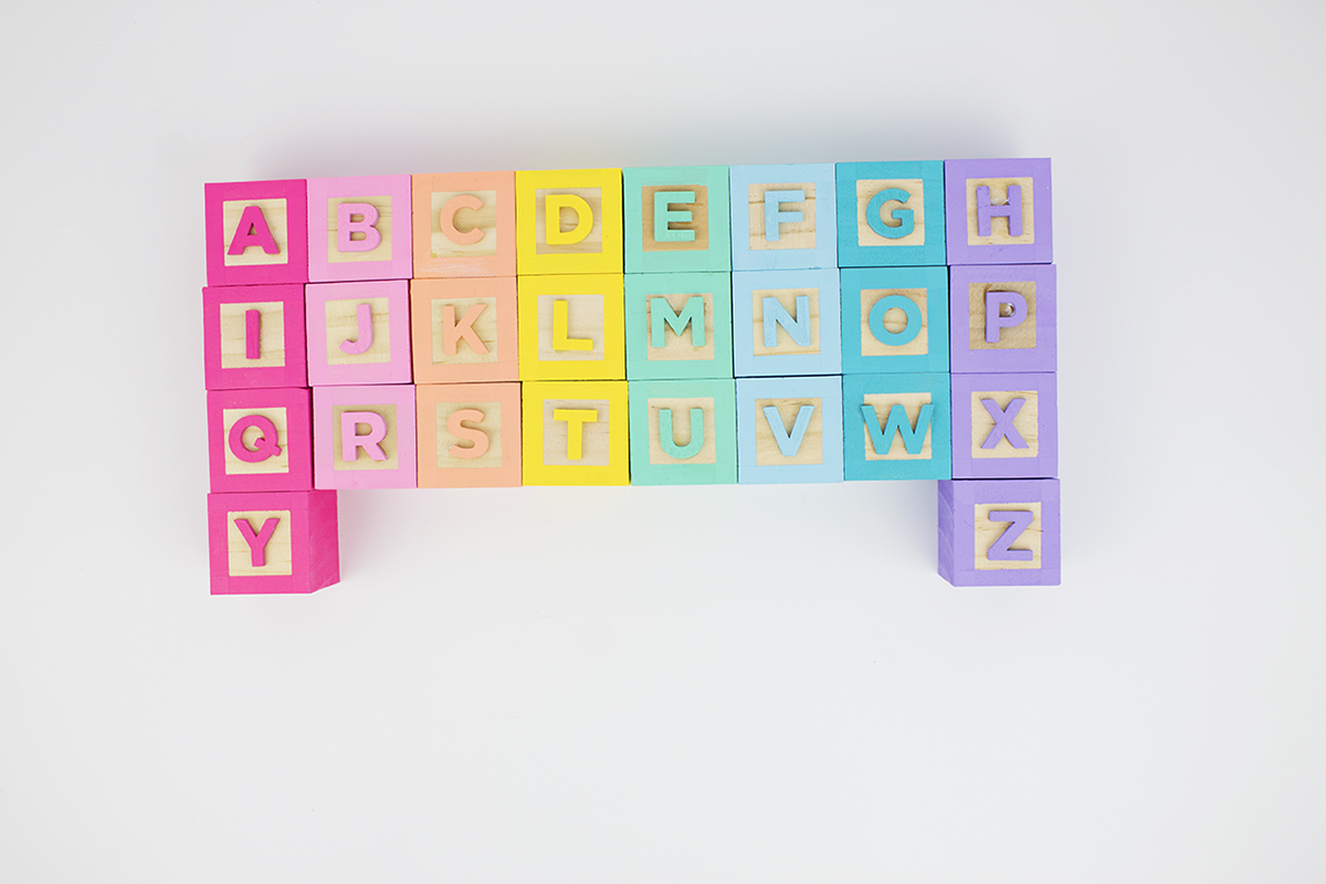 Colorful rainbow alphabet baby blocks? Yes please! Find out how to make a set for yourself. Click for the full how-to!
