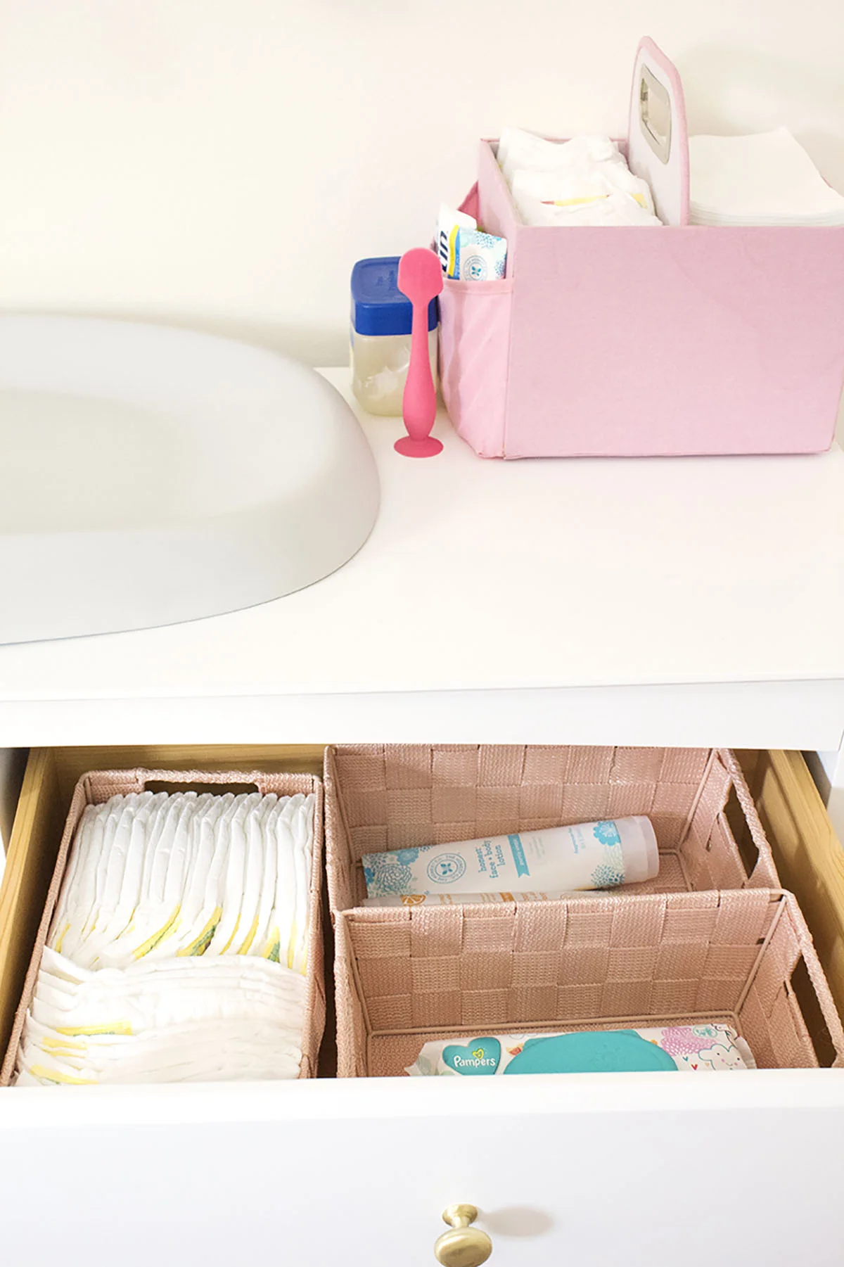 Looking for some nursery organization ideas? Check out this colorful and affordable nursery tour! From the closet to the dressers, I’ll show you where to store all of baby’s essentials. #nurseyorganizationideas #nurseryorganizationhacks #nurserydresserorganization
