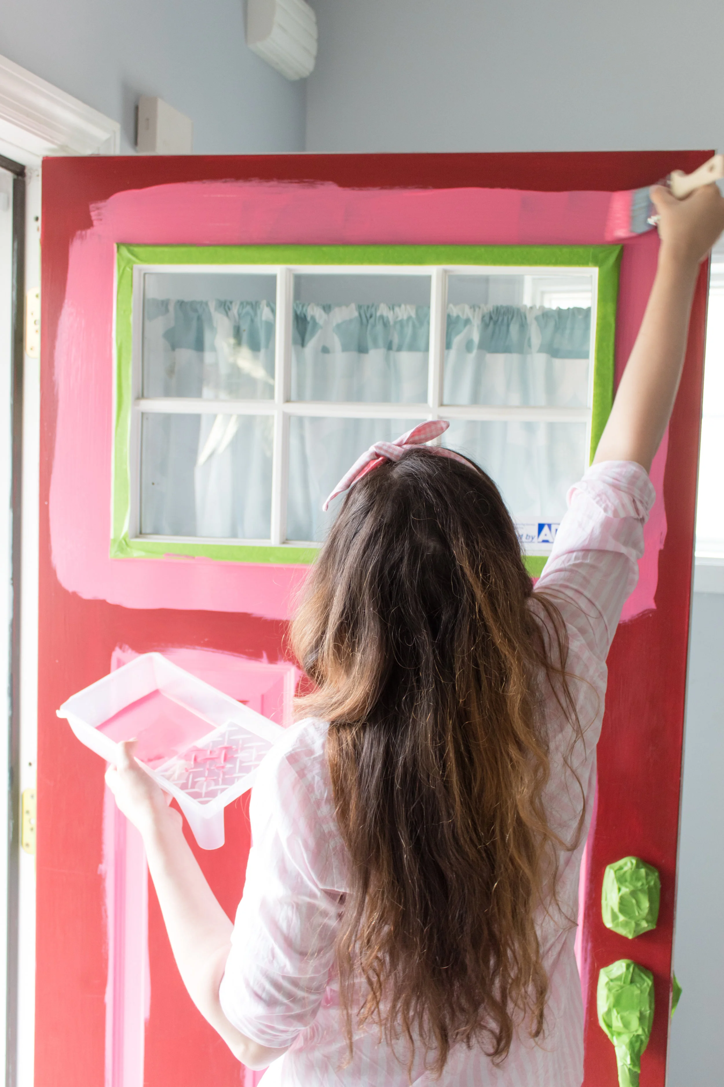 On Wednesday’s we paint our door pink!! With the help of FrogTape, I was able to paint my door without having to remove the hardware. It was easy peasy lemon squeezy, and left such crisp clean lines! Head to the blog for all the details so you can give your front door a facelift for spring! #frontdoormakeover #frontdoorcolors #pinkdoor