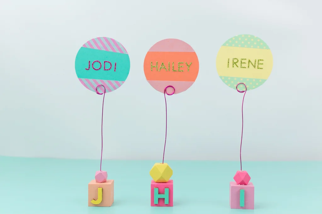 Summer is here, and that means constant get-togethers, picnics, and BBQ's. What could be better than a simple summer tablescape featuring these washi tape placecards? Get the super easy how-to on the blog! #placecards #washitapecrafts #summercrafts