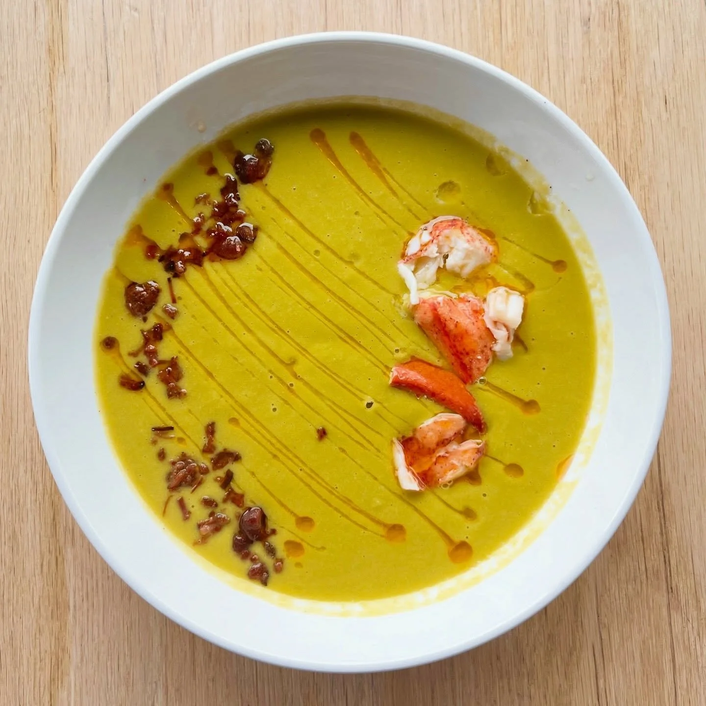 Back on the menu just in time for spring! 

Our spring pea soup with butter poached lobster, bacon and chili oil🫛🦞