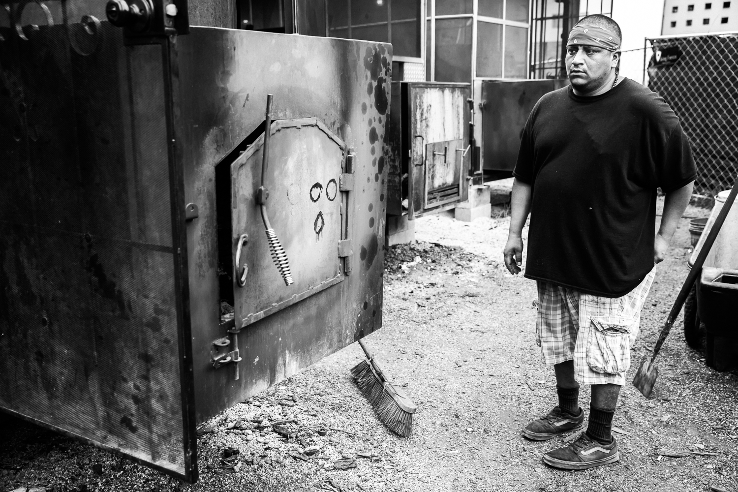  Francisco readies to stoke the smoker's fire. La Barbecue, 14 May 2016, Austin, TX. 