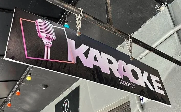 A sign with karaoke printed on it