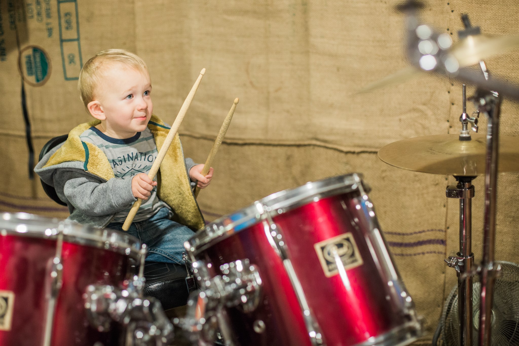 My son playing the drums at age 1. Standing to the right of the camera is his Papa, and my son's face tells you everything you need to know about how he feels right in that second. 