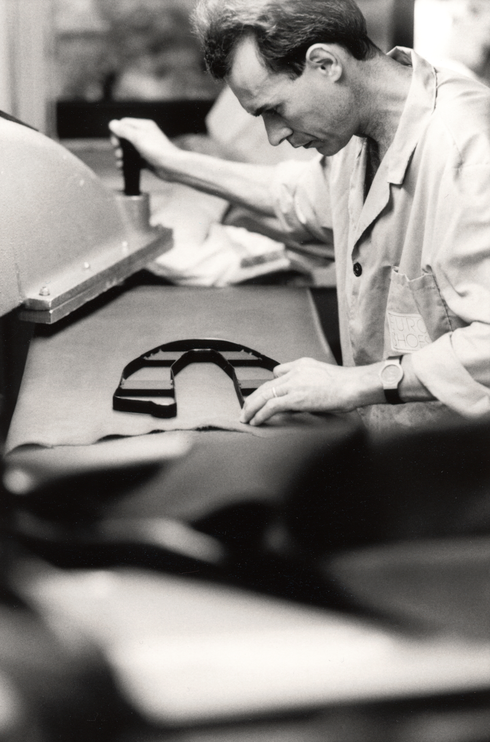 02_ guy cutting leather .jpg