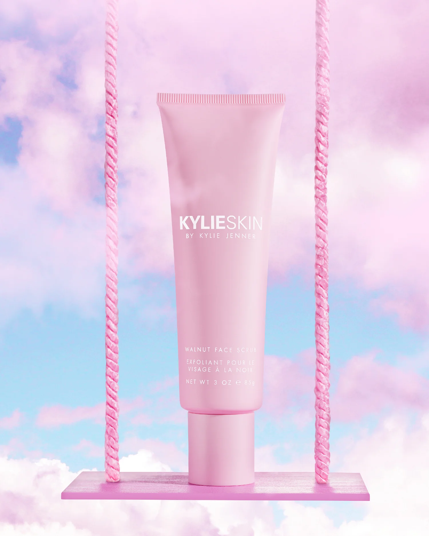 kylie skin product photography skincare los angeles. still life photographer. kylie jenner skincare line. water splash photography. bottle on swing in pink clouds