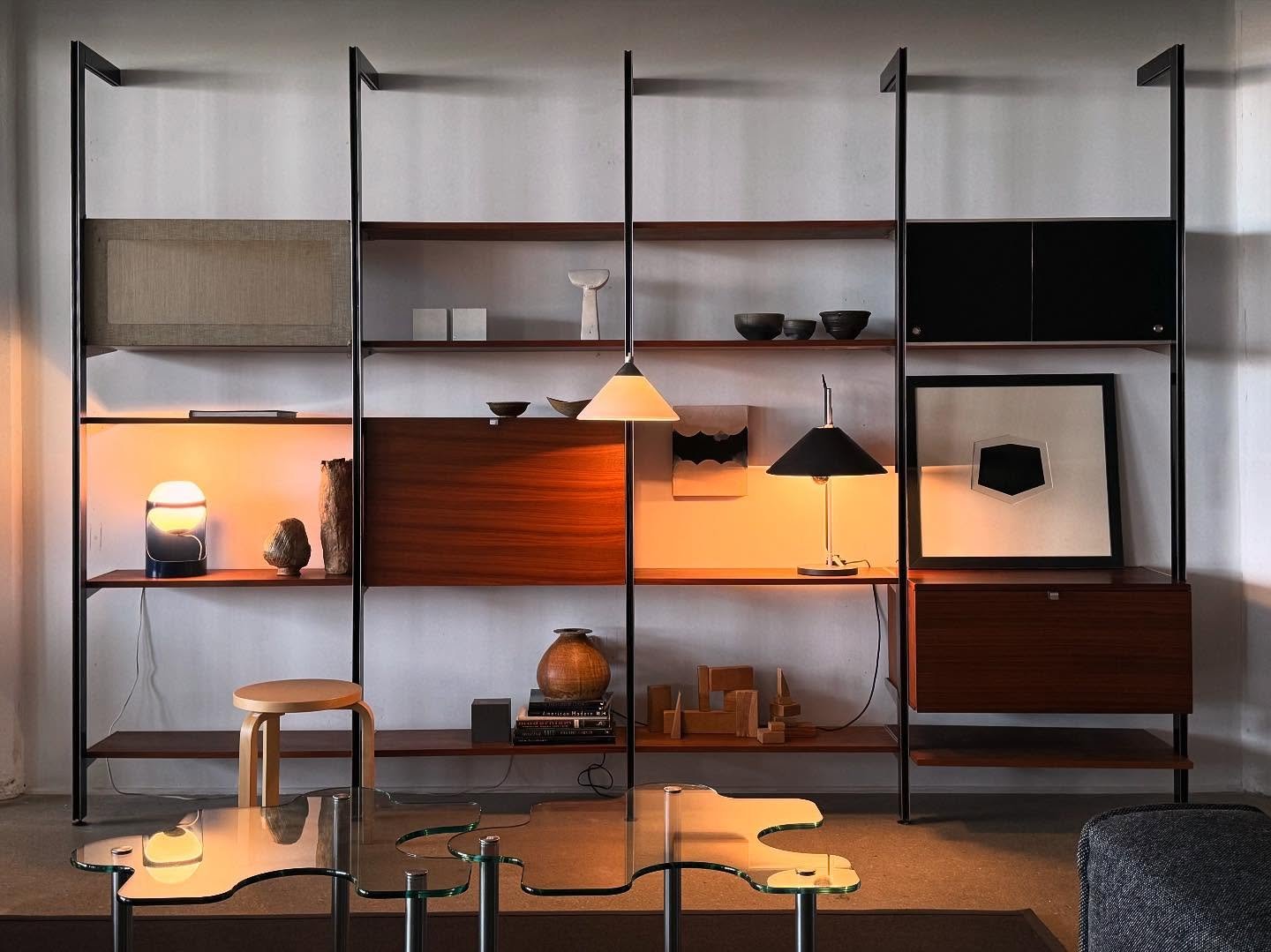 Done installing this one. (4 bay CSS - designed by George Nelson) includes everything shown: a drop down secretary desk / HIFI cabinet / flip up fabric door cabinet / sliding door cabinet / 11 shelves
