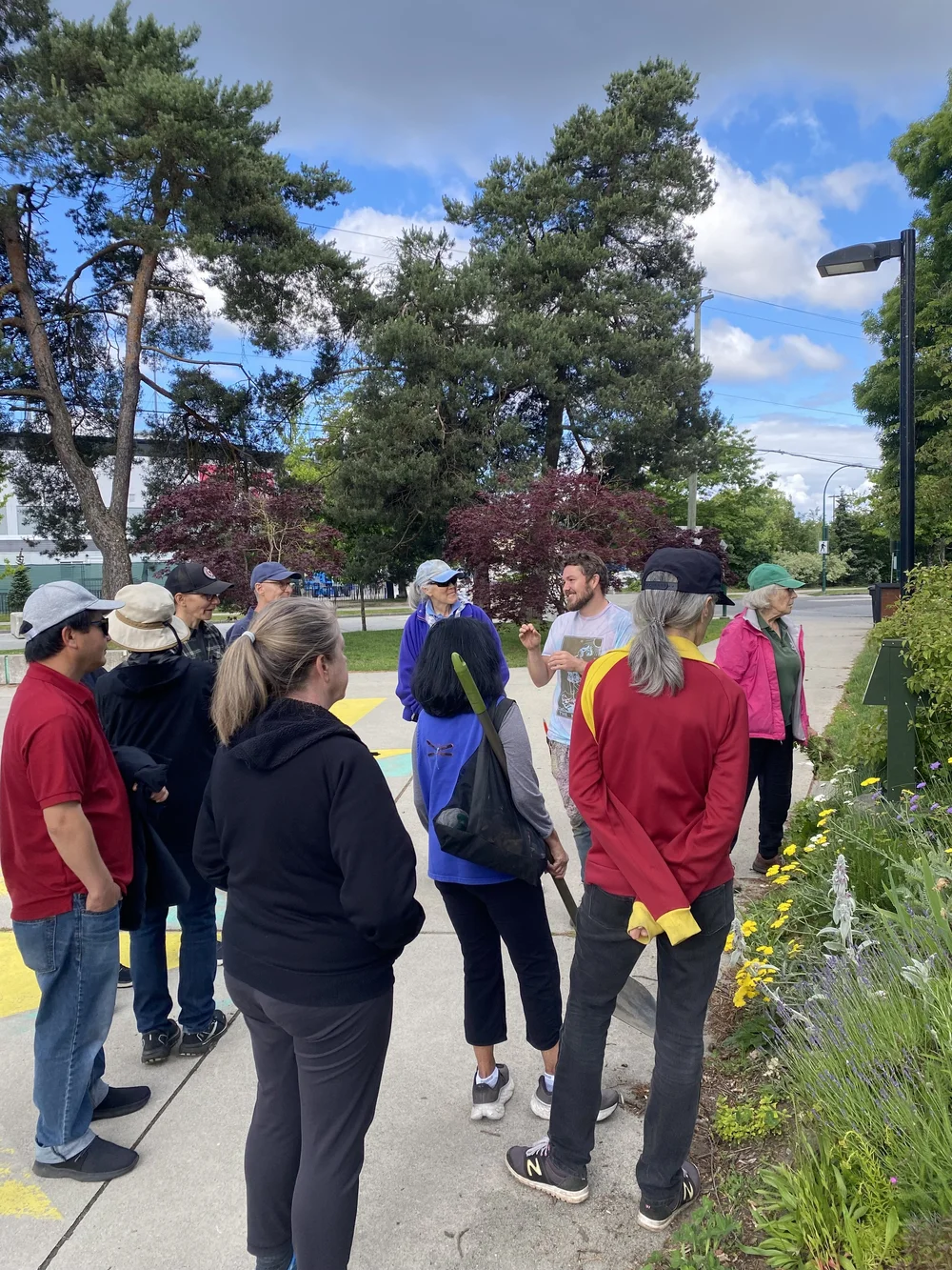  Lots of learning is happening! Walking along the outside perimeter of the garden to learn more about drought-tolerant plants &nbsp; 