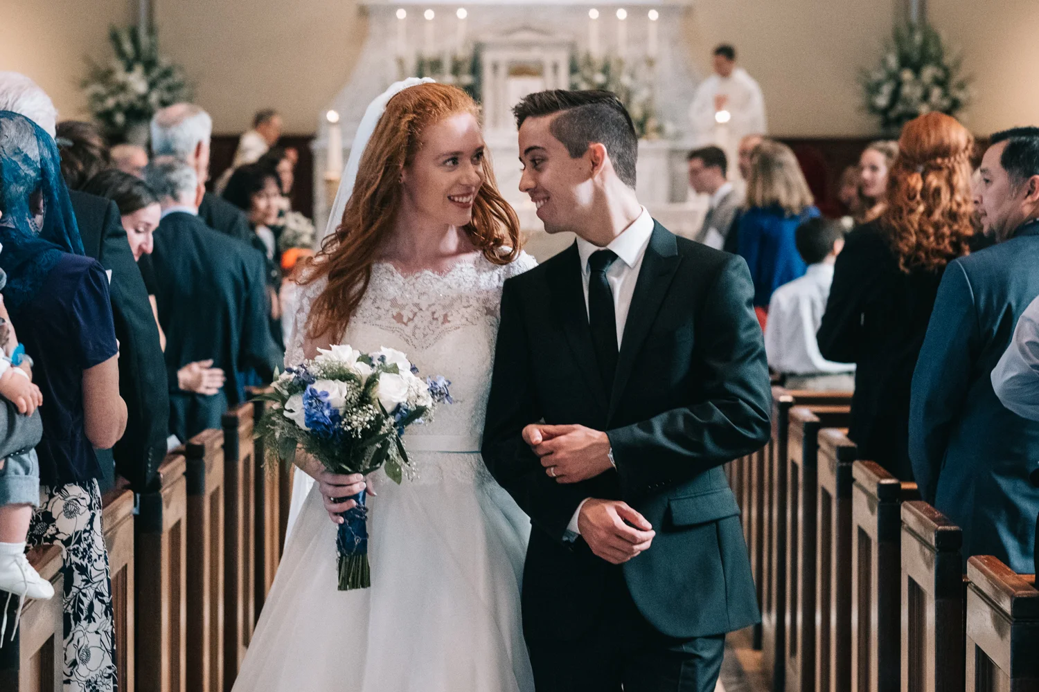 bride and groom recessional catholic wedding