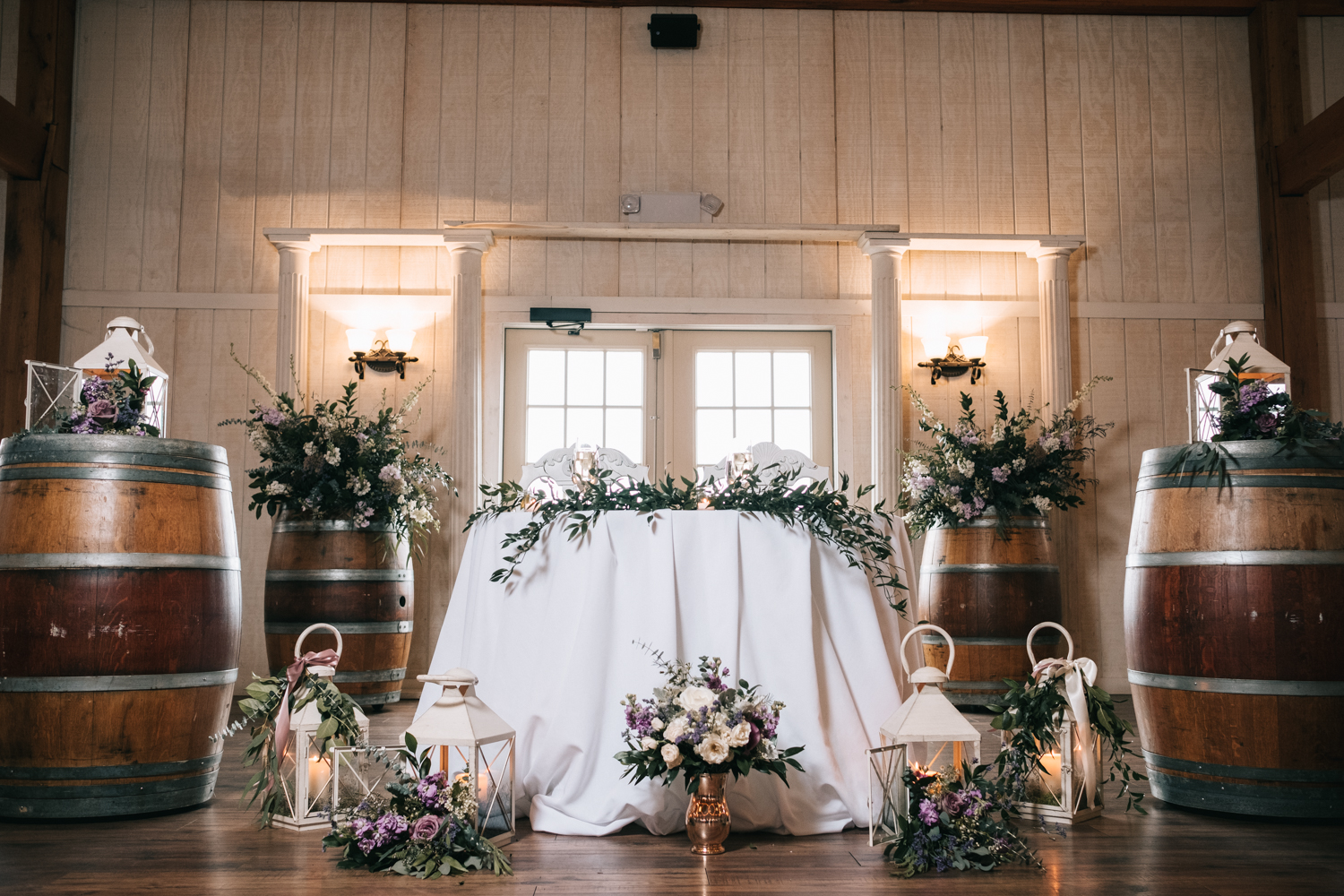 barn wedding bride and groom table design flowers