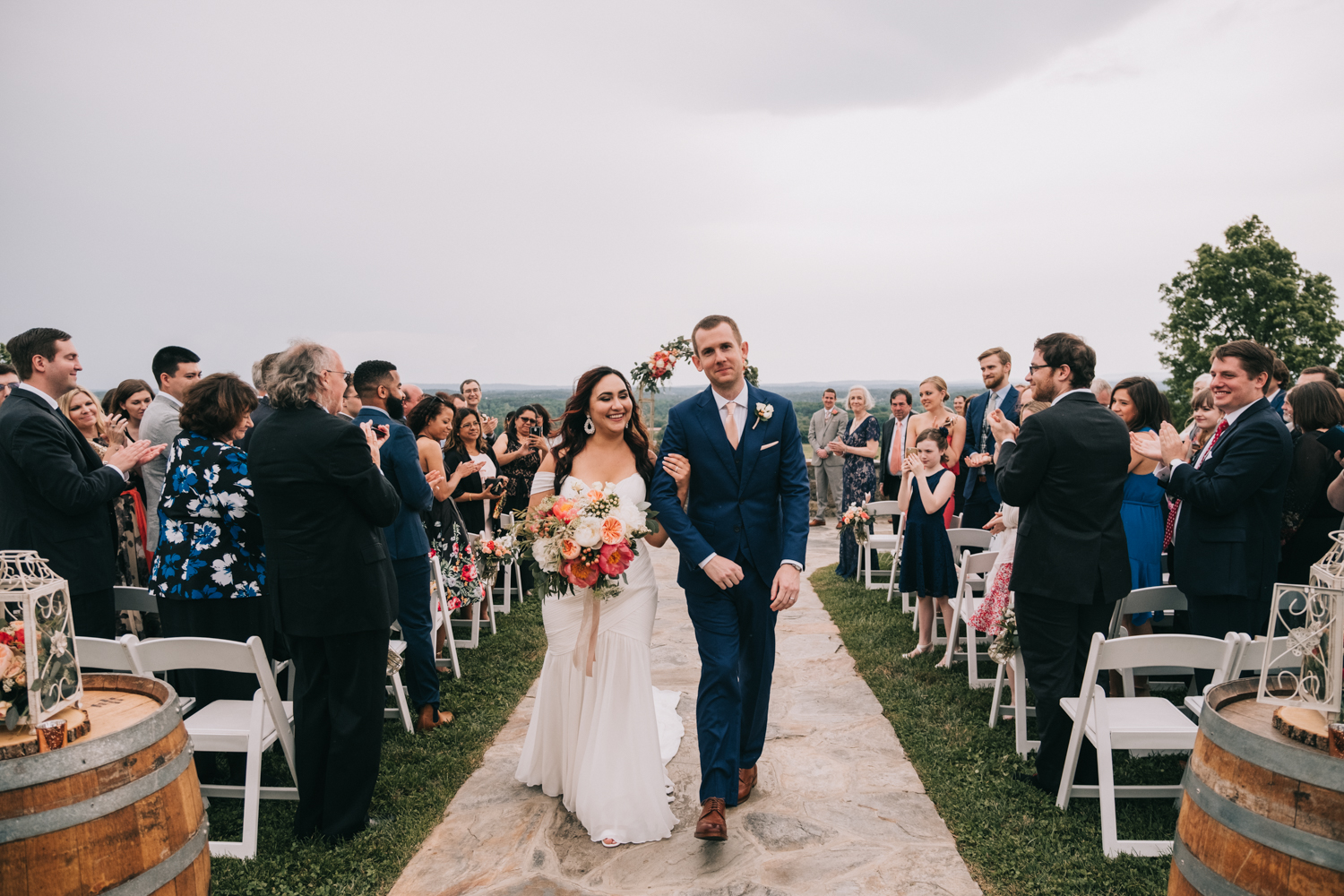 newly married at the stables at bluemont vineyard walking up the aisle inspiration