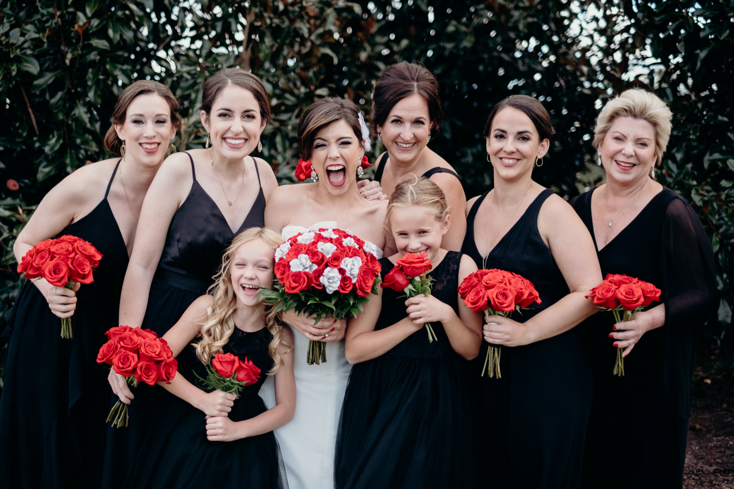 bridesmaids pose and laugh for portraits