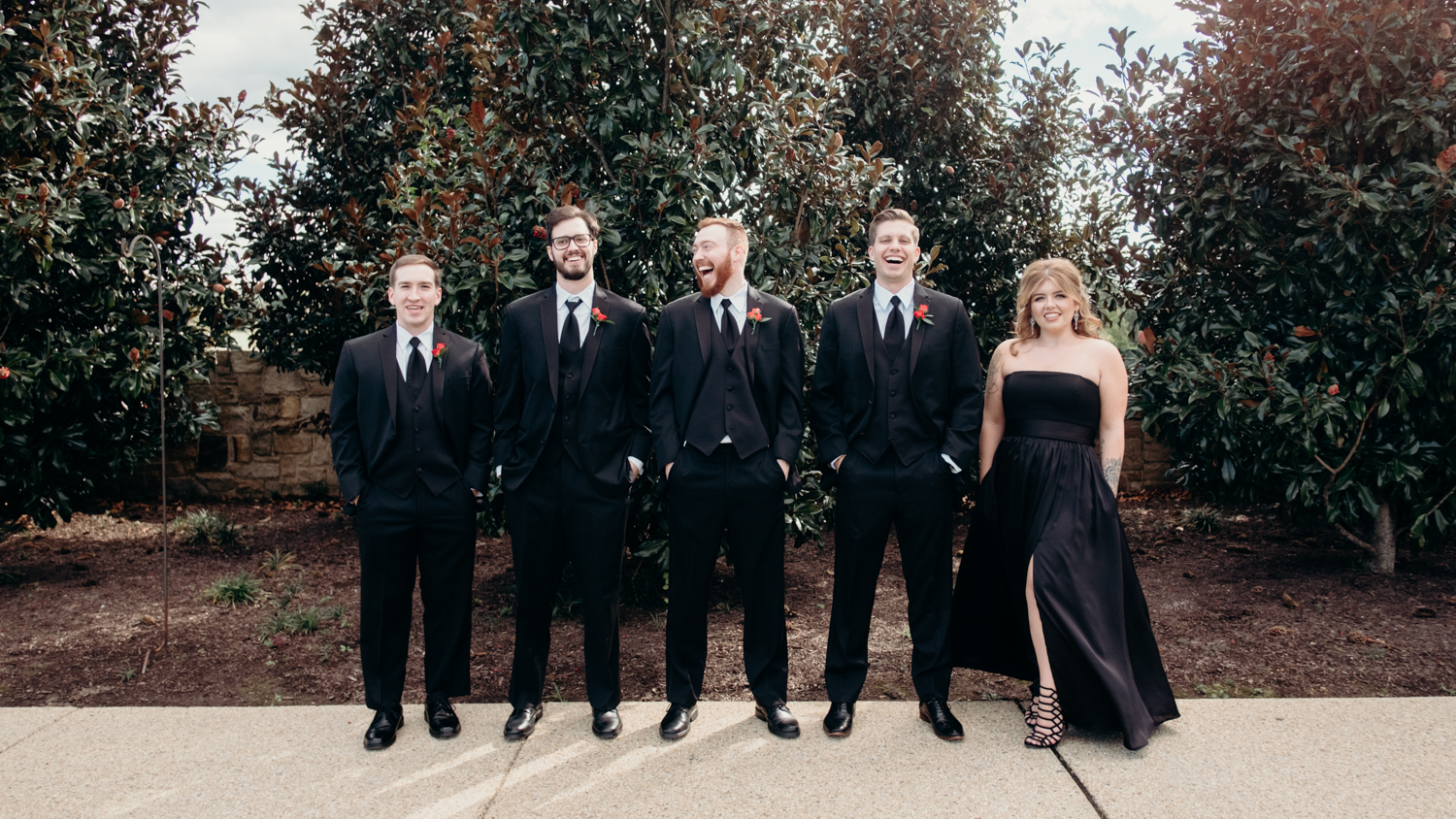 groomsmen pose and laugh for portraits