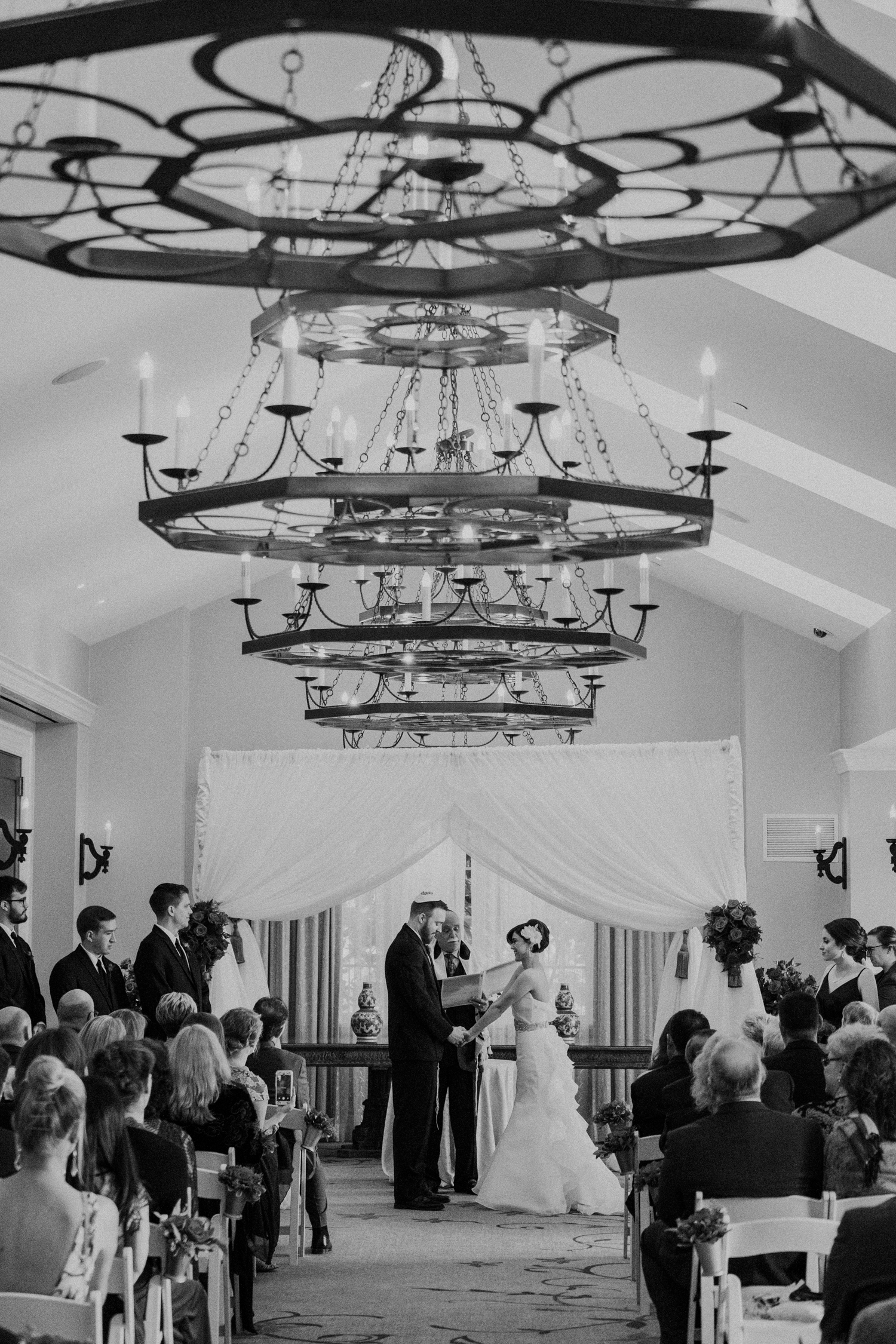 Indoor salamander resort wedding ceremony under chandeliers
