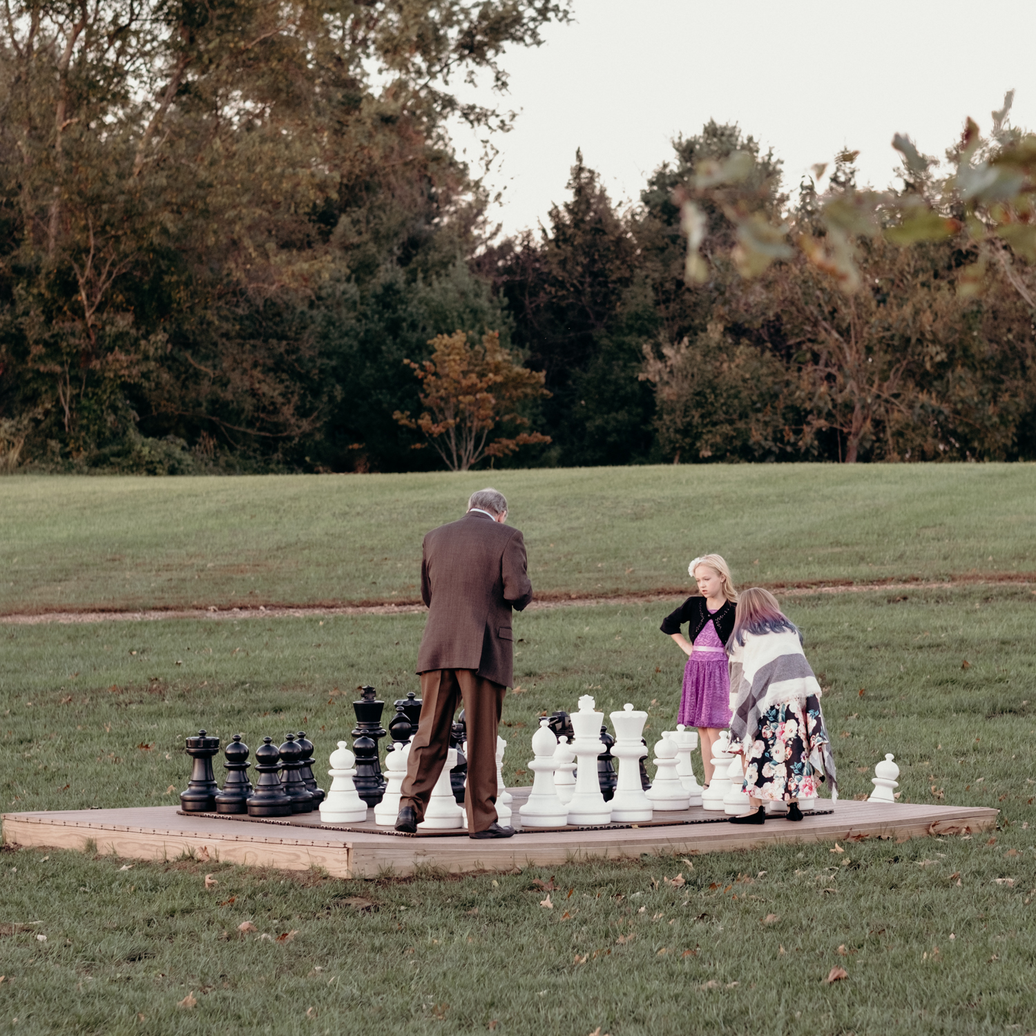 guests play giant game of chess at salamander resort during wedding