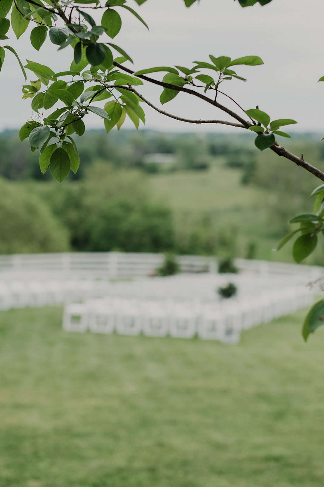 Chairs are set up for an outdoor spring wedding ceremony at Blue Hill Farm in Waterford, VA. 