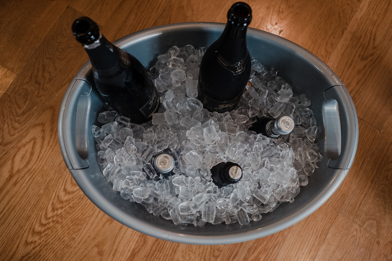 Champagne sits on ice in a galvanized bucket in the getting ready room at Blue Hill Farm in Waterford, VA. 