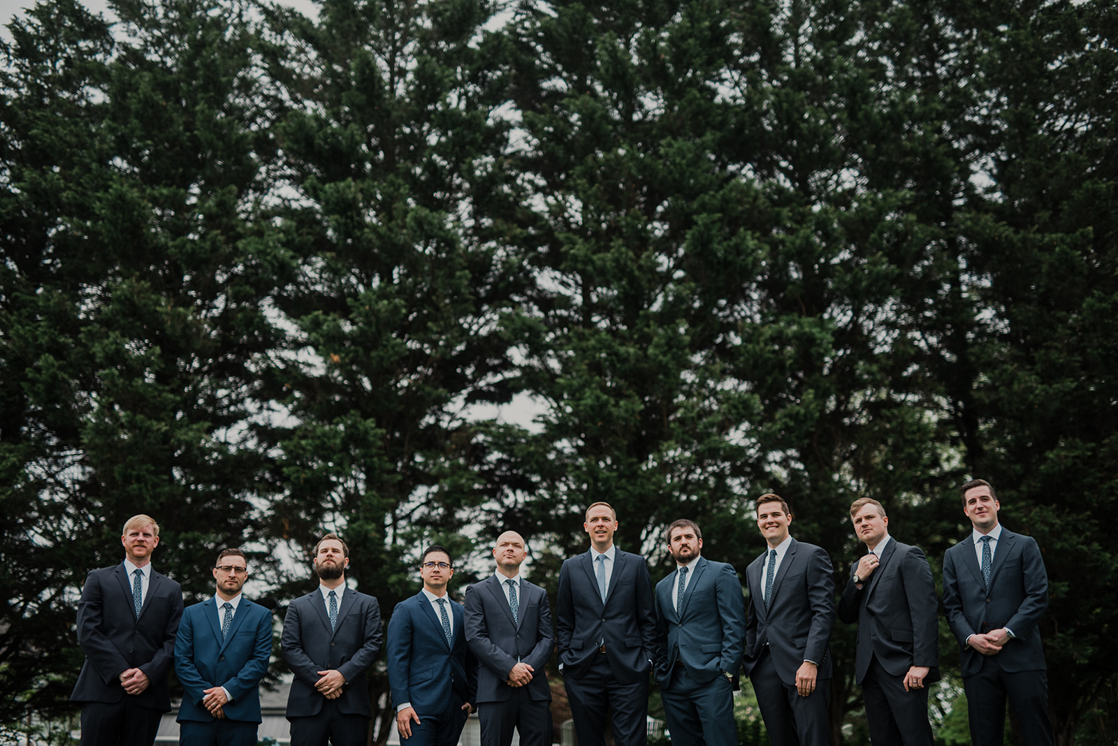 The groomsmen gather together before an outdoor wedding ceremony at Blue Hill Farm in Waterford, VA.