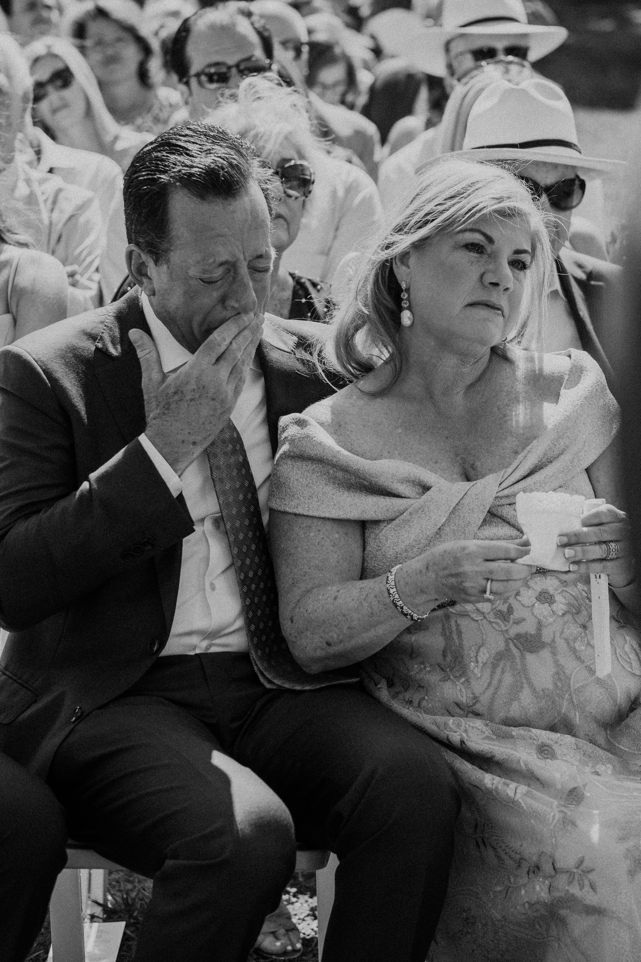 groom's parents cry during the ceremony