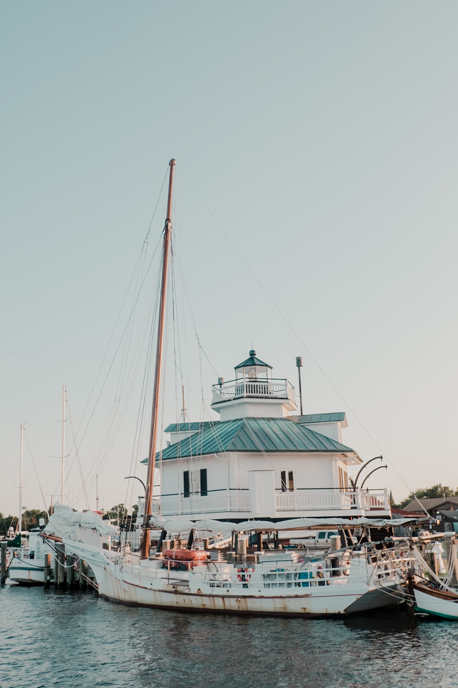 chesapeake bay maritime museum wedding view of sailboats at the docks with lighthouse 