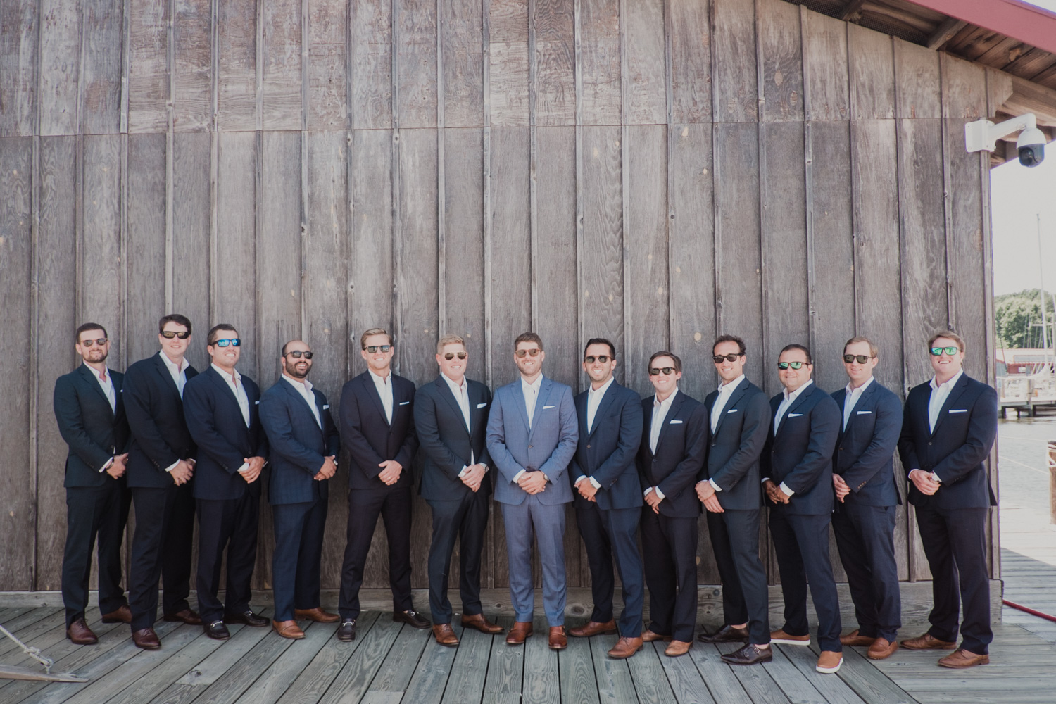 groomsmen portrait on the docks at chesapeake bay maritime museum